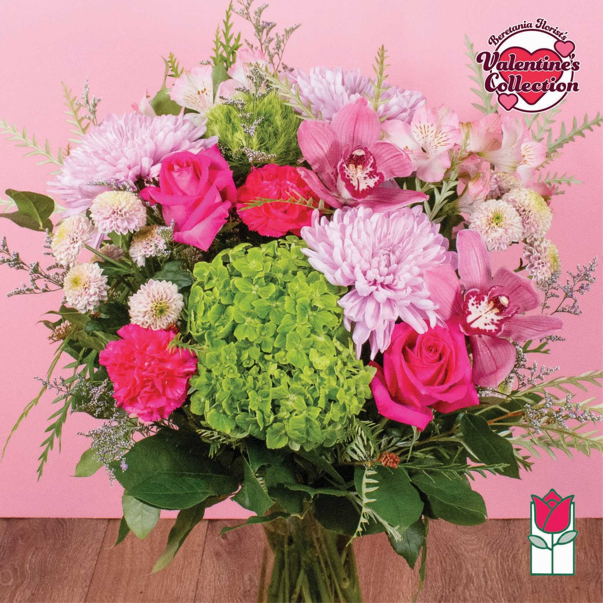 Pink and green mixed bouquet with roses, orchids, and chrysanthemums