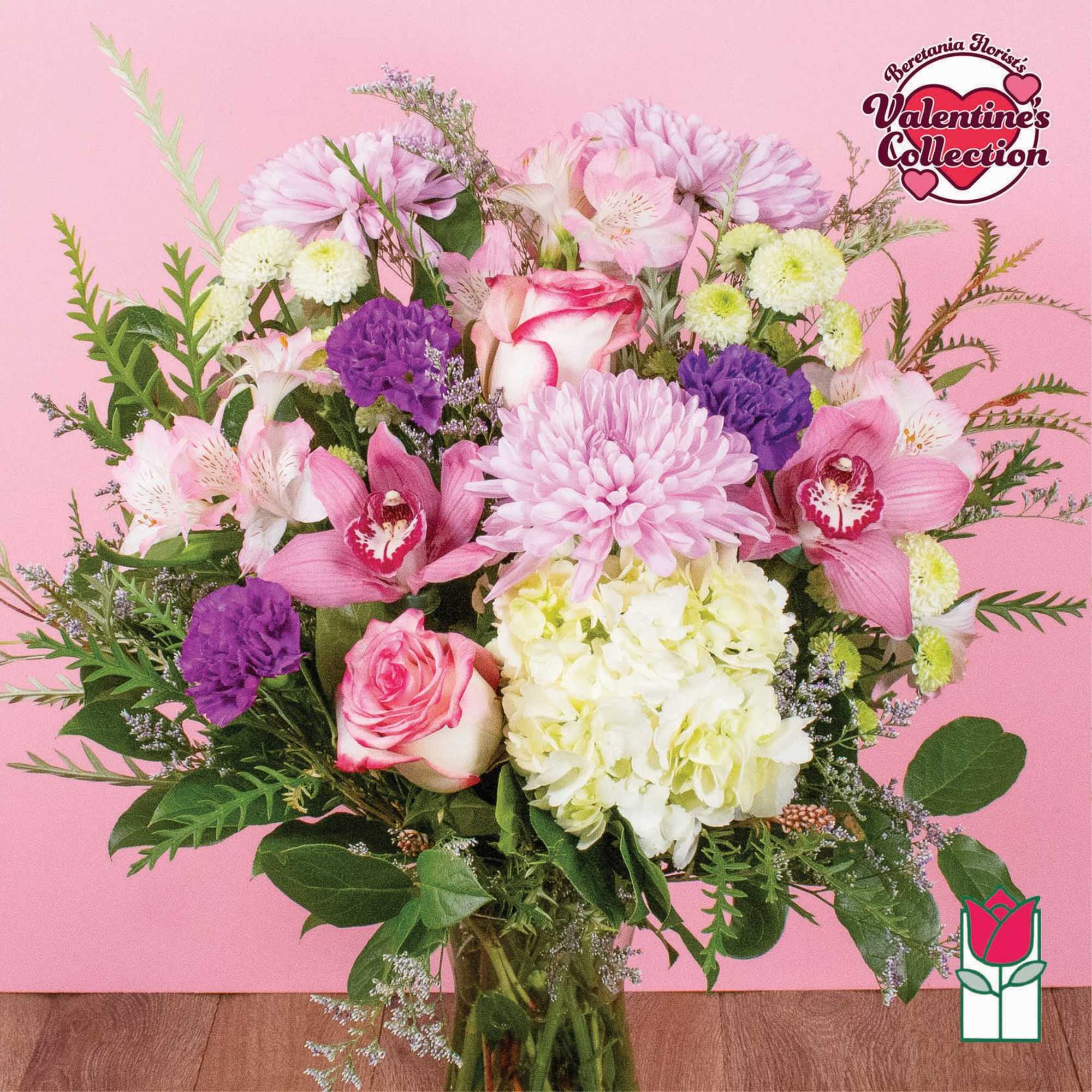 Pink and white mixed bouquet with roses, orchids, hydrangea, and chrysanthemums
