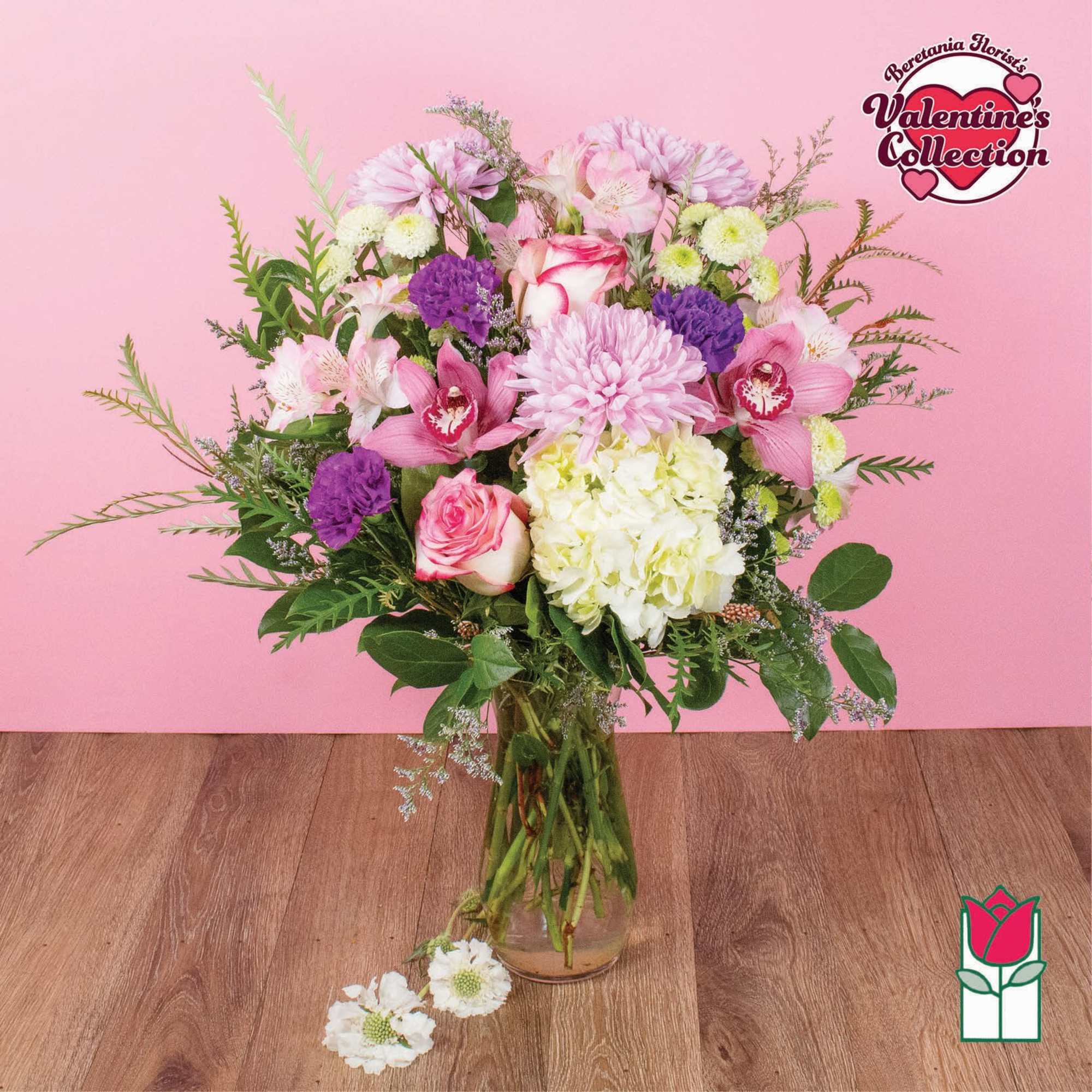 Pink and purple mixed bouquet in a clear glass vase