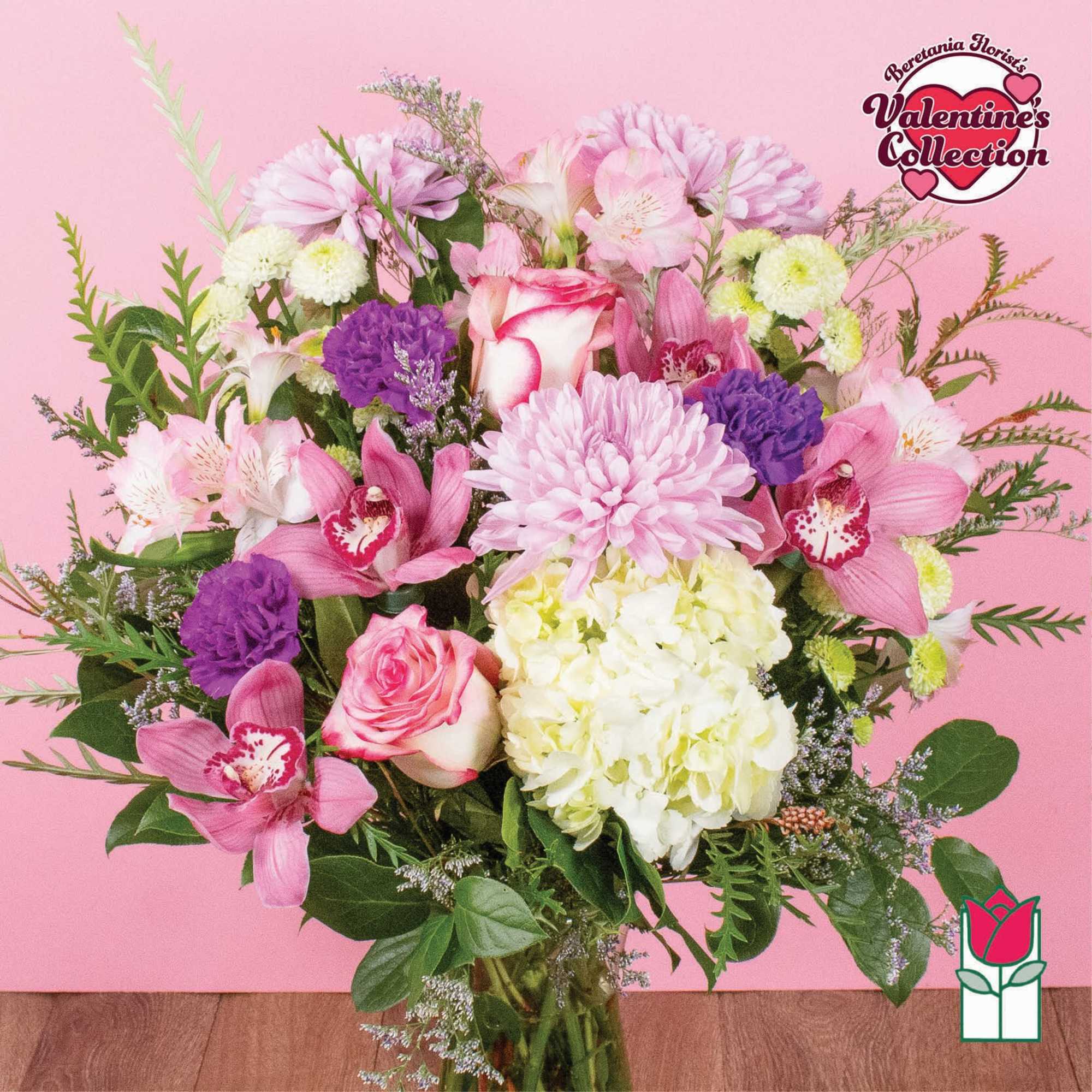 Pink and white mixed bouquet with orchids, roses, hydrangea, and chrysanthemums
