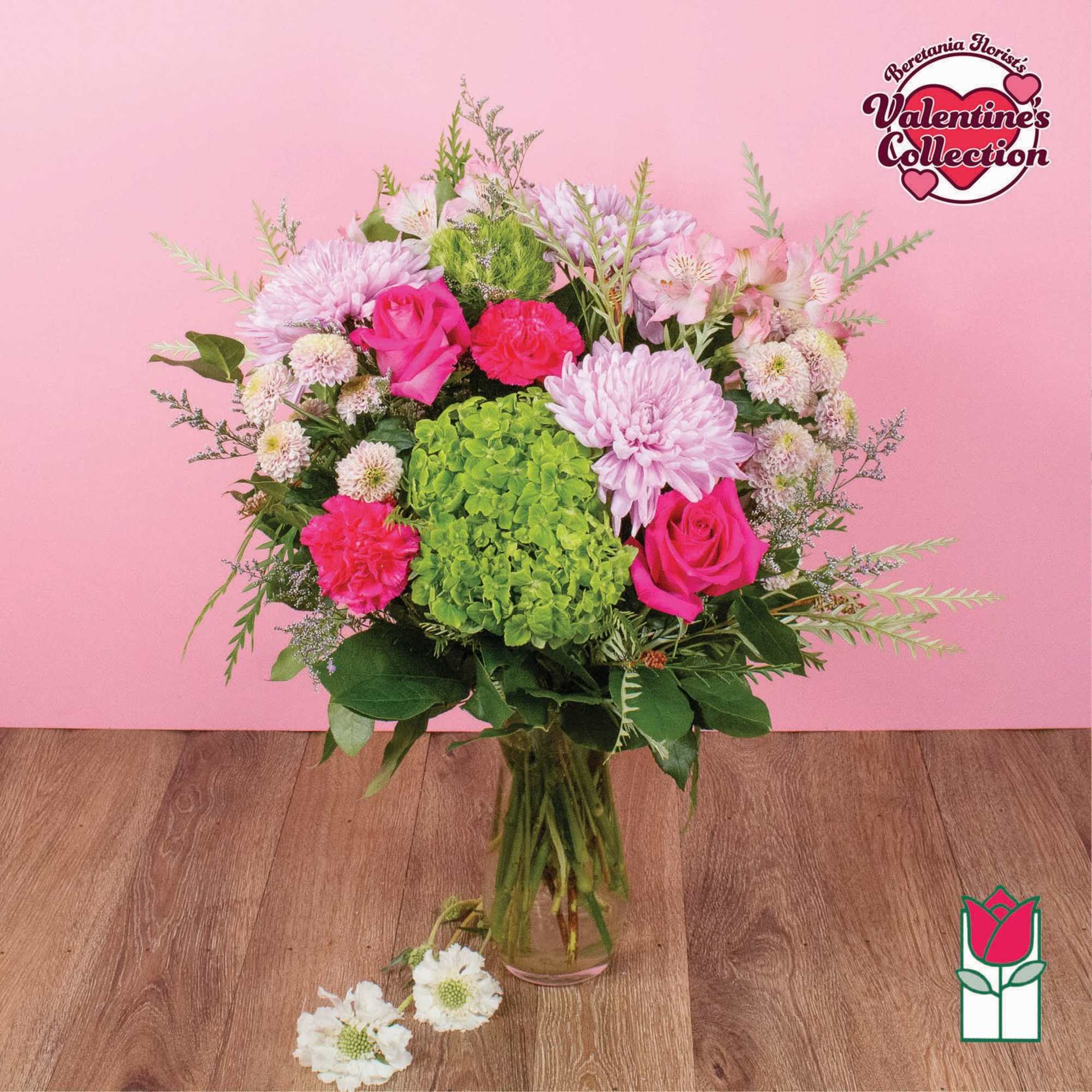Pink and green mixed bouquet in a clear glass vase
