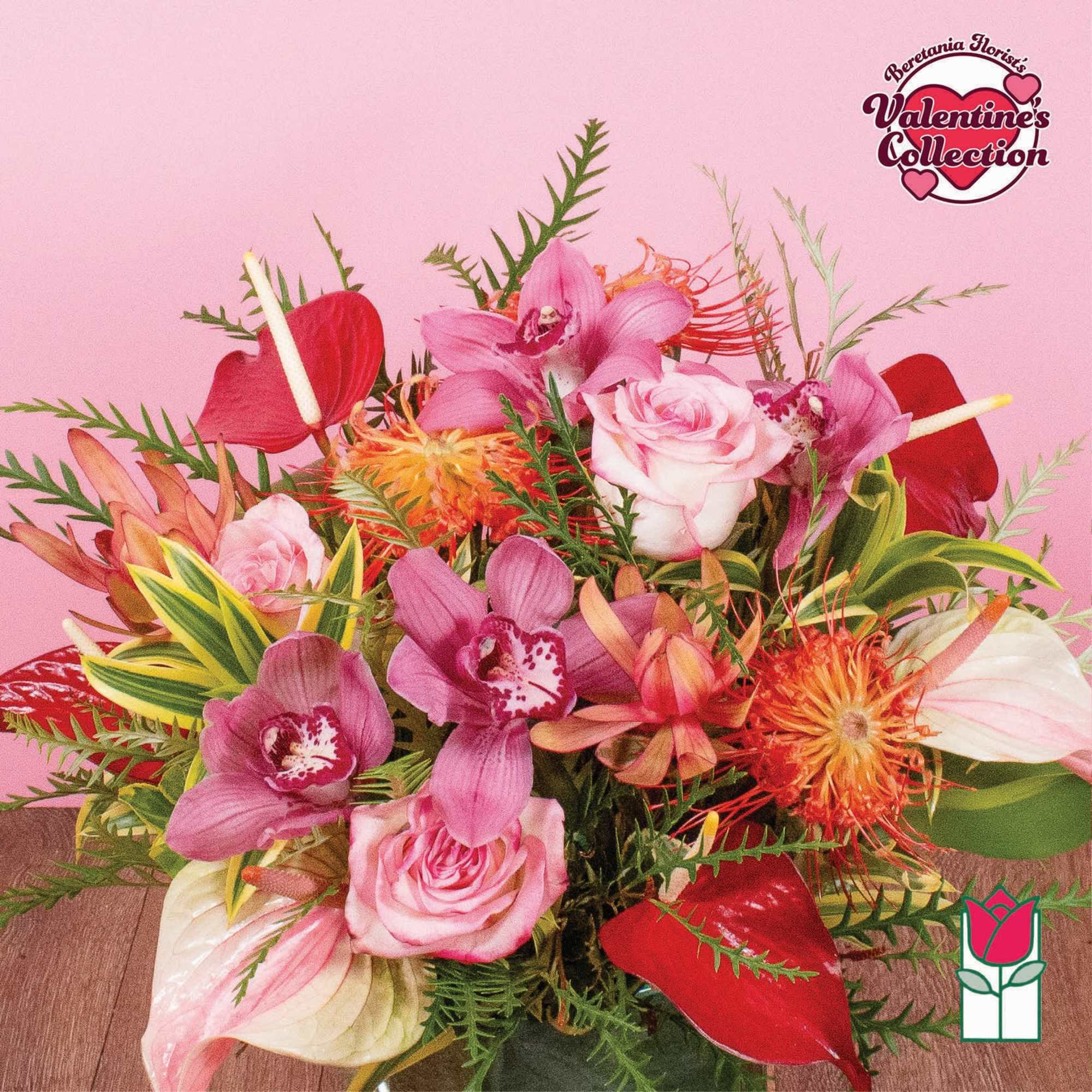 Medium arrangement of pink roses, orchids, red anthuriums and orange protea in a clear glass vase
