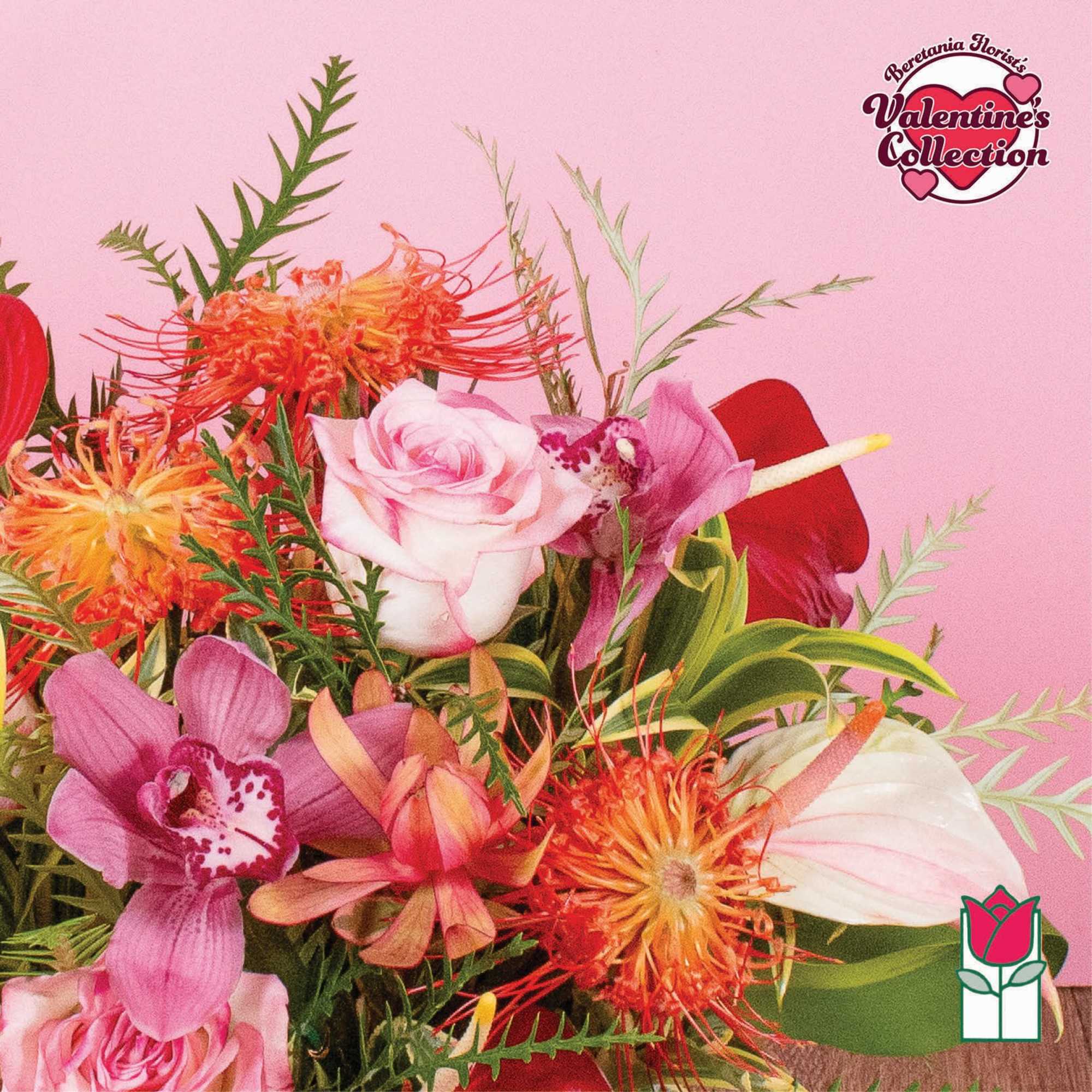 Mixed bouquet of pink roses, orchids, red and white anthuriums, and orange protea on a pink background