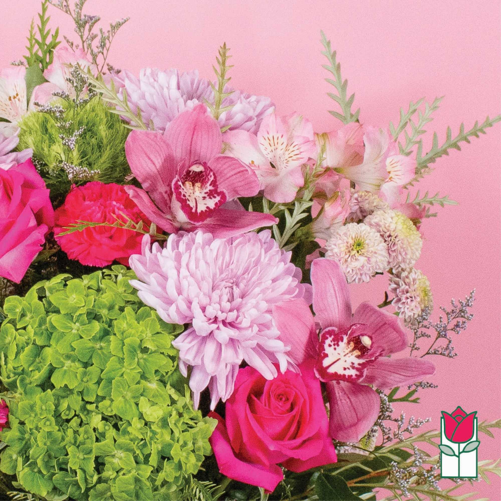 Pink and green floral bouquet with orchids, roses, and chrysanthemums