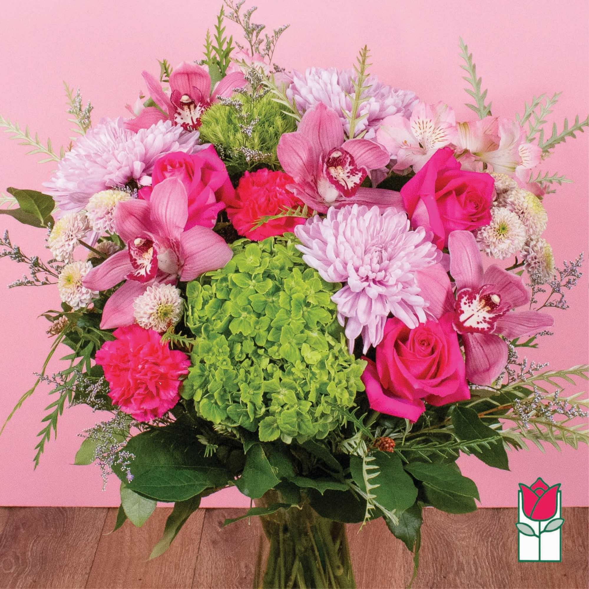 Pink and green mixed bouquet with roses, orchids, hydrangea, and chrysanthemums