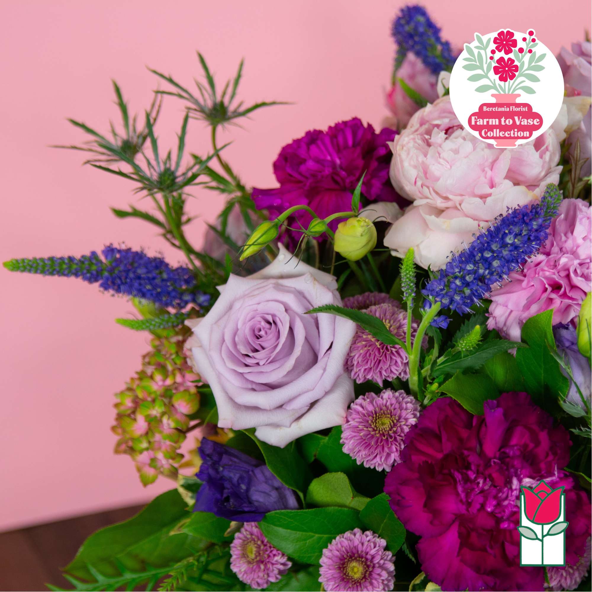 Bouquet of lavender roses, pink peonies, and purple blooms