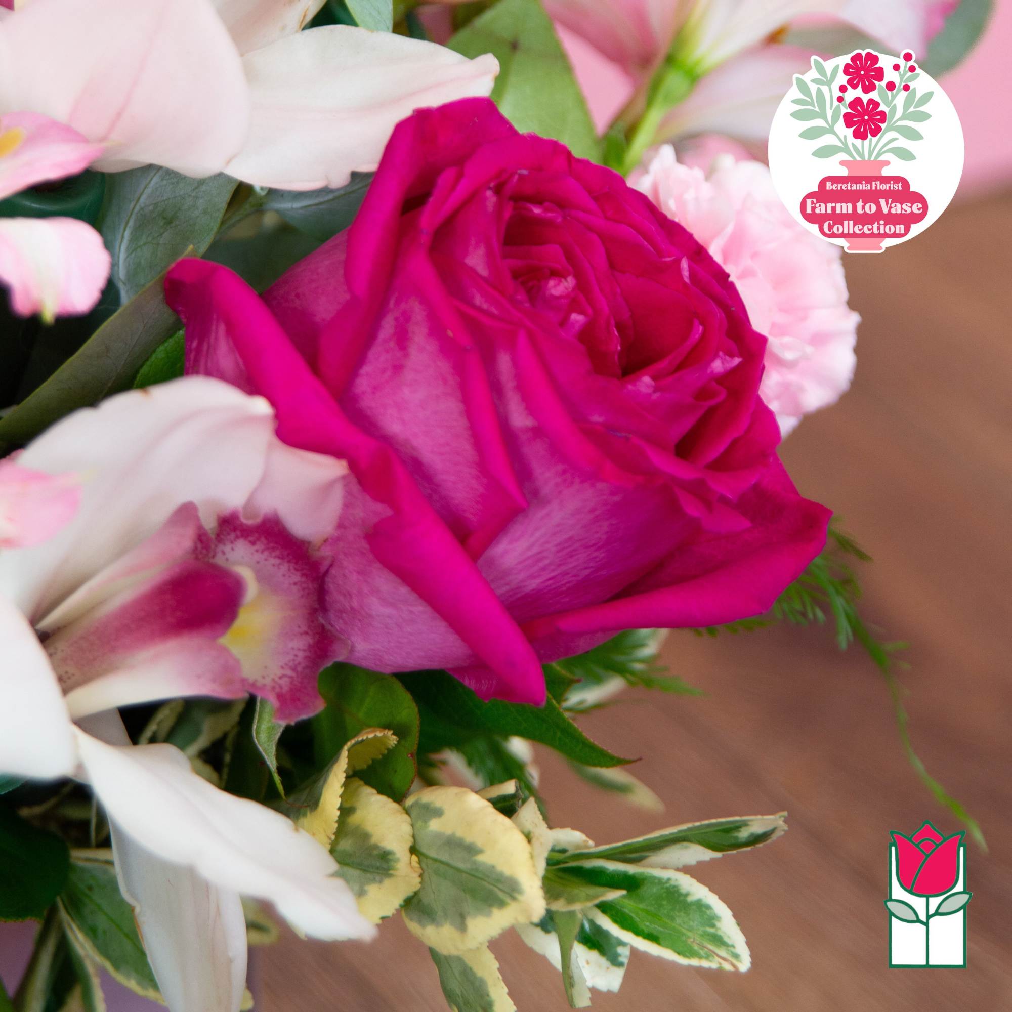 Close-up bouquet with a bright pink rose and pale pink and white flowers