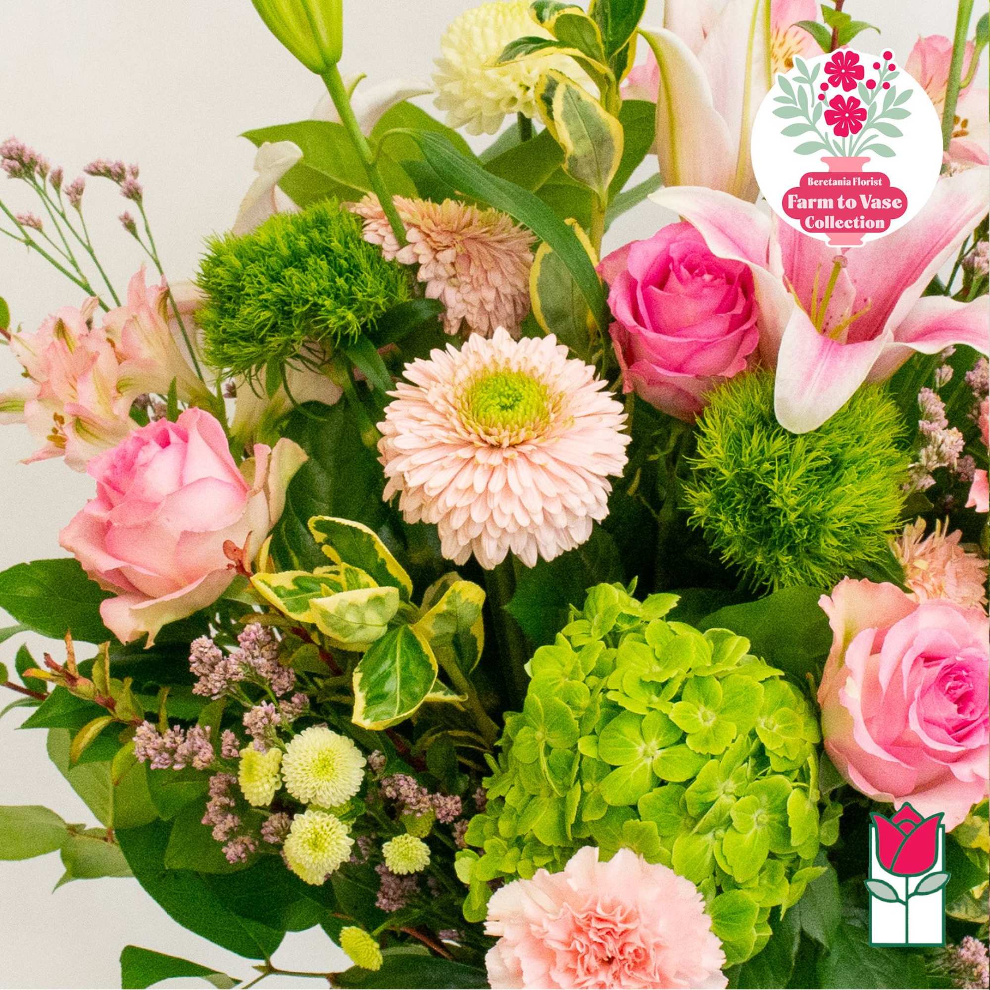 Pink roses and lilies with green hydrangea in a mixed bouquet
