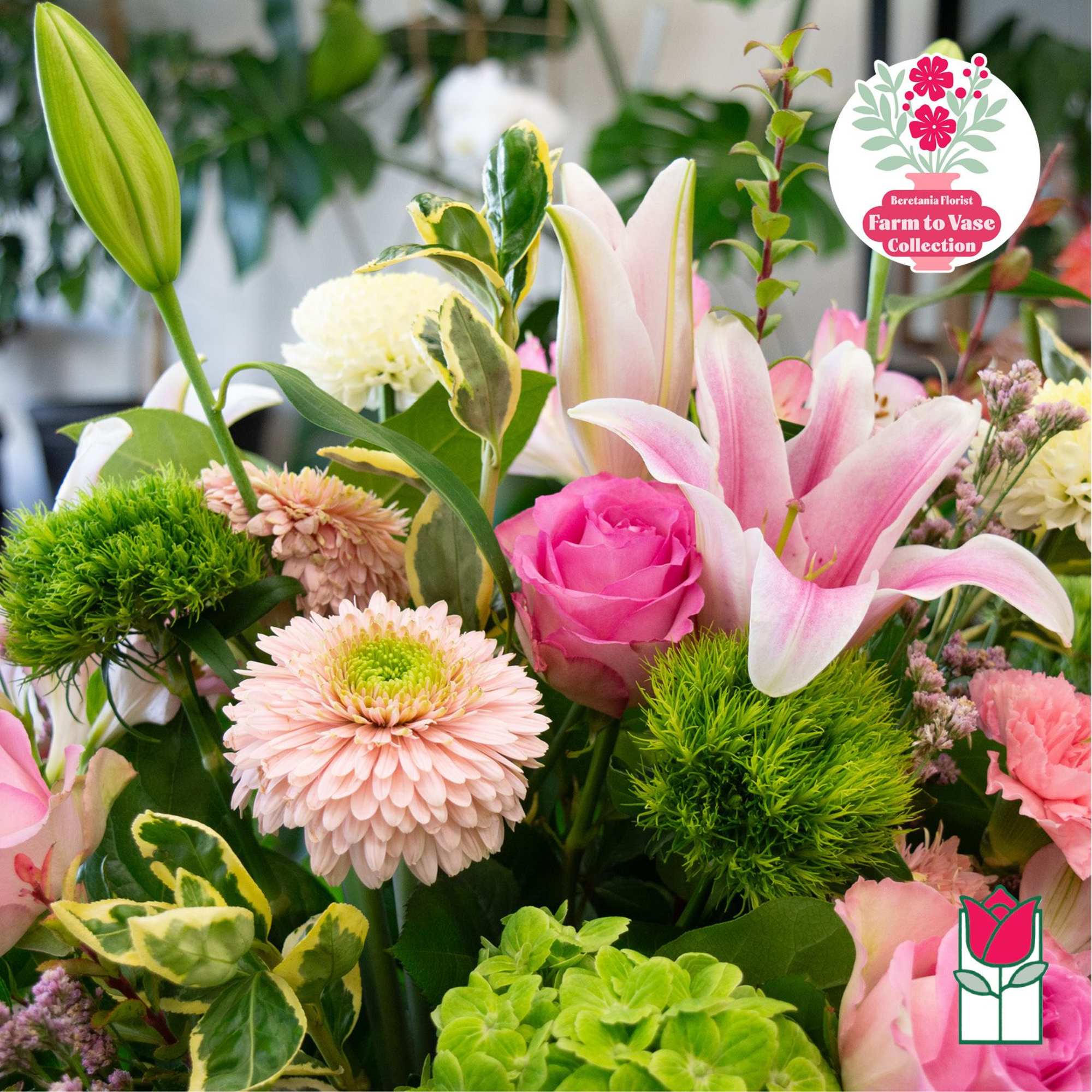 Mixed bouquet with pink lilies, roses, and pale chrysanthemums