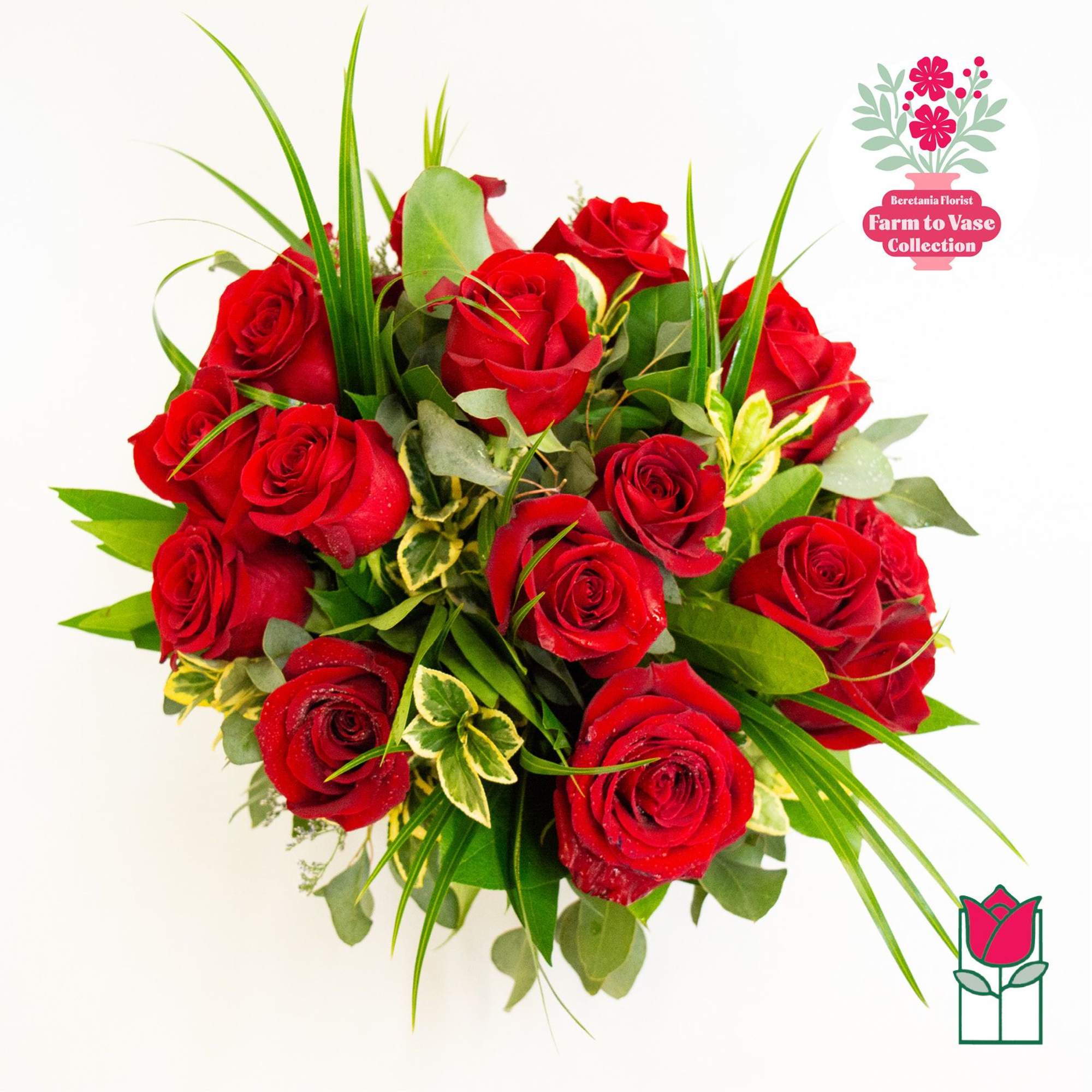 Bouquet of red roses with mixed greenery on a white background