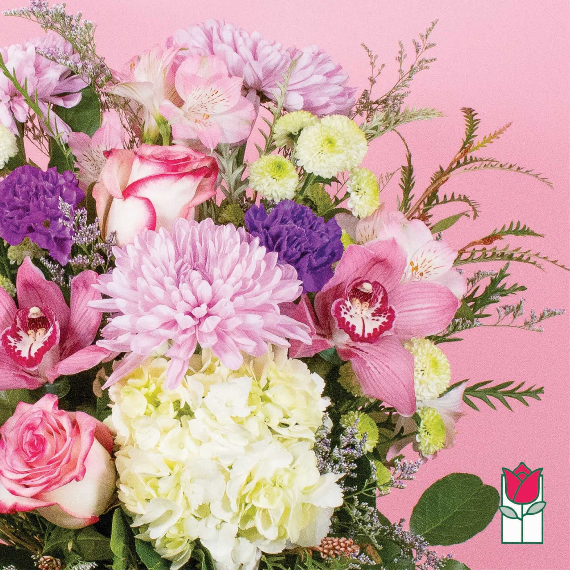 Pink and white mixed bouquet with orchids, roses, and chrysanthemums