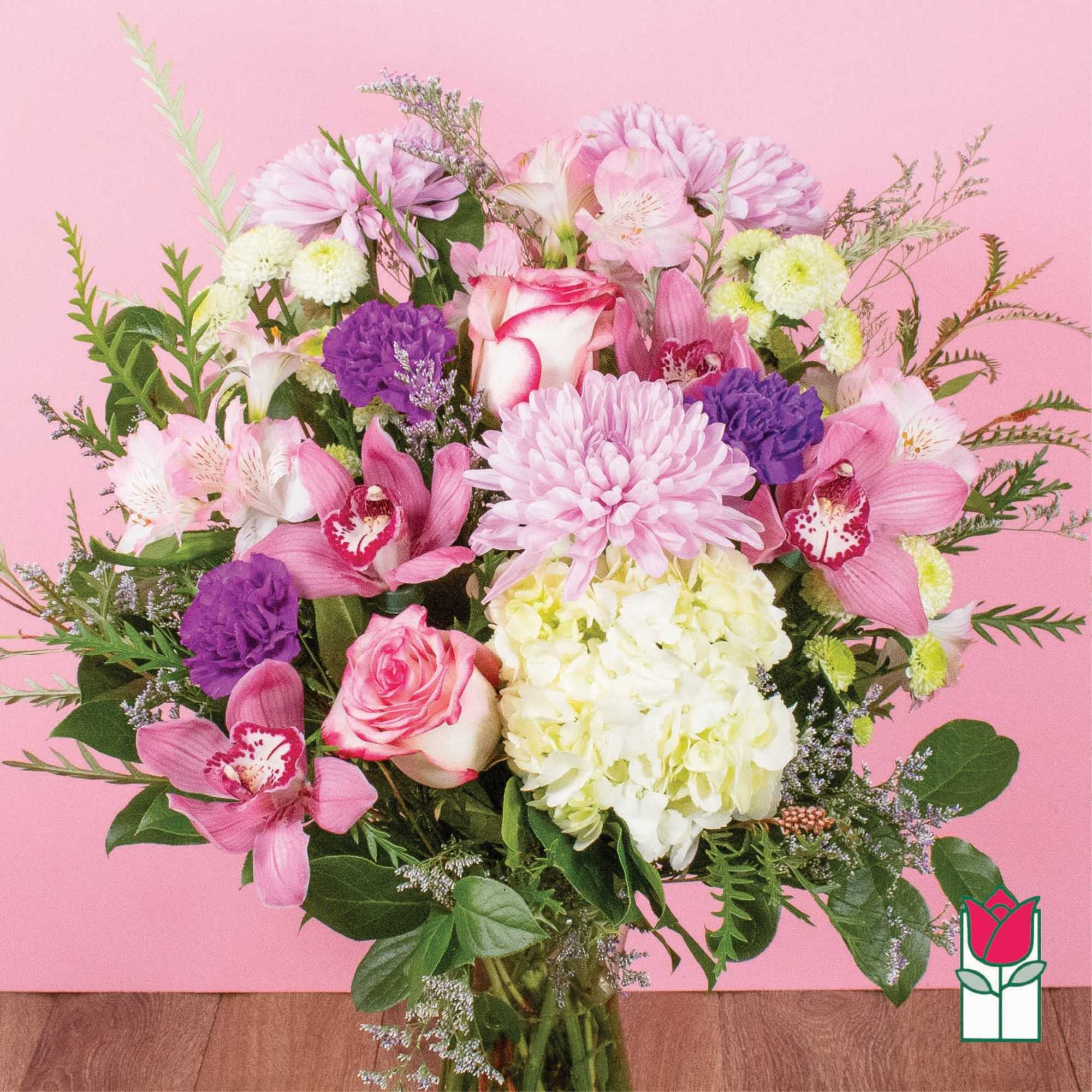 Pink and white mixed bouquet with roses, orchids, and hydrangea