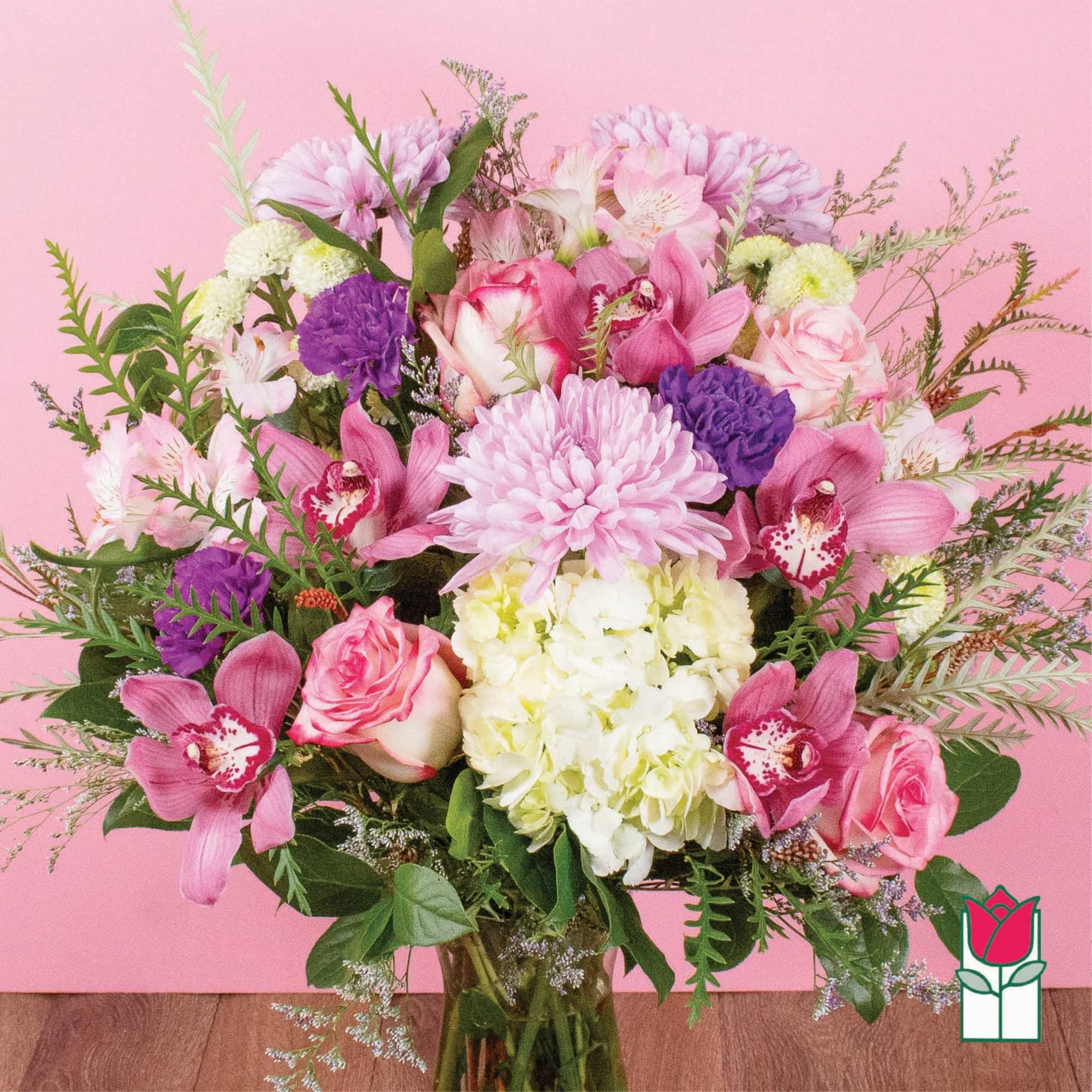 Pink and purple mixed bouquet in a glass vase