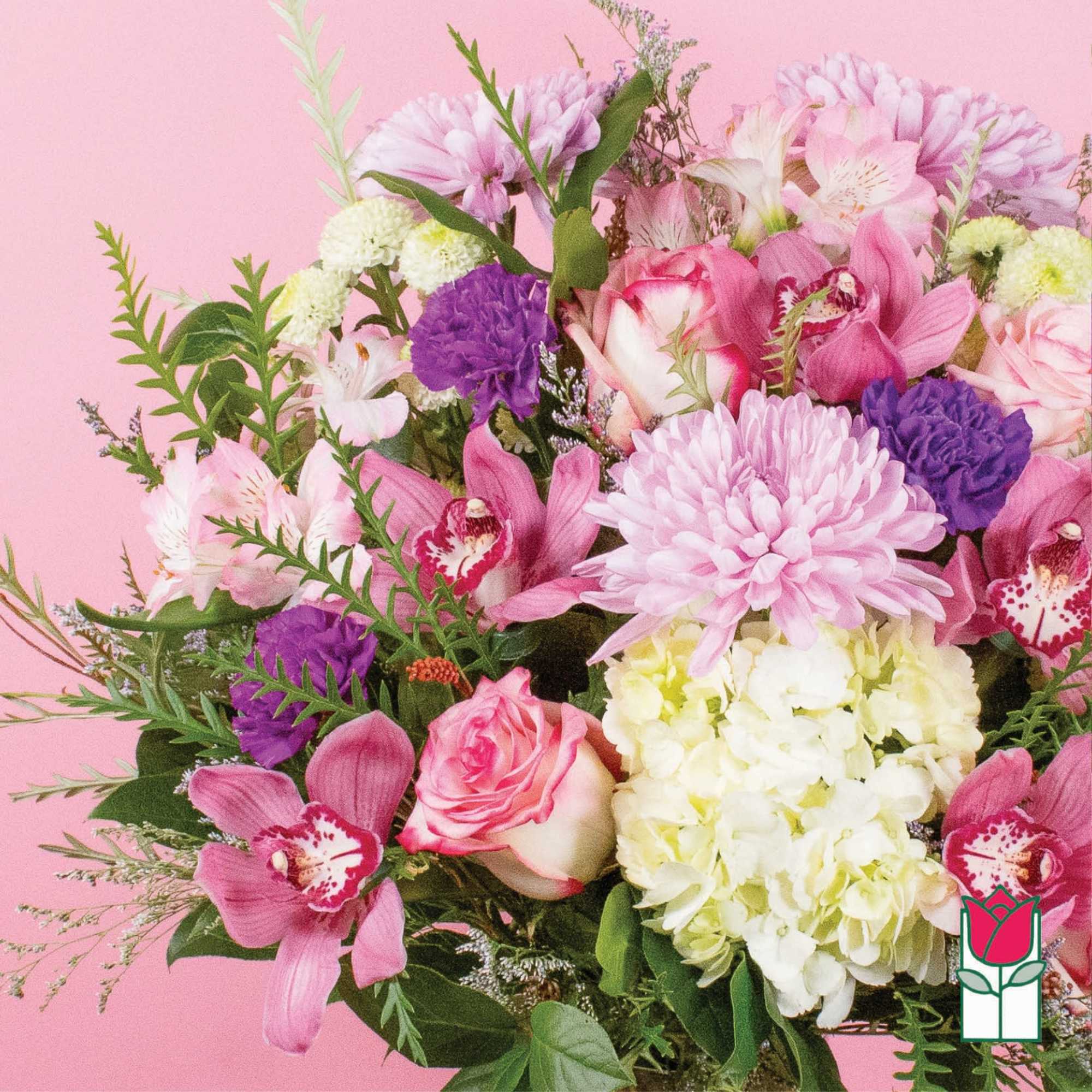 Pink and white mixed bouquet with orchids, roses, hydrangea, and chrysanthemums