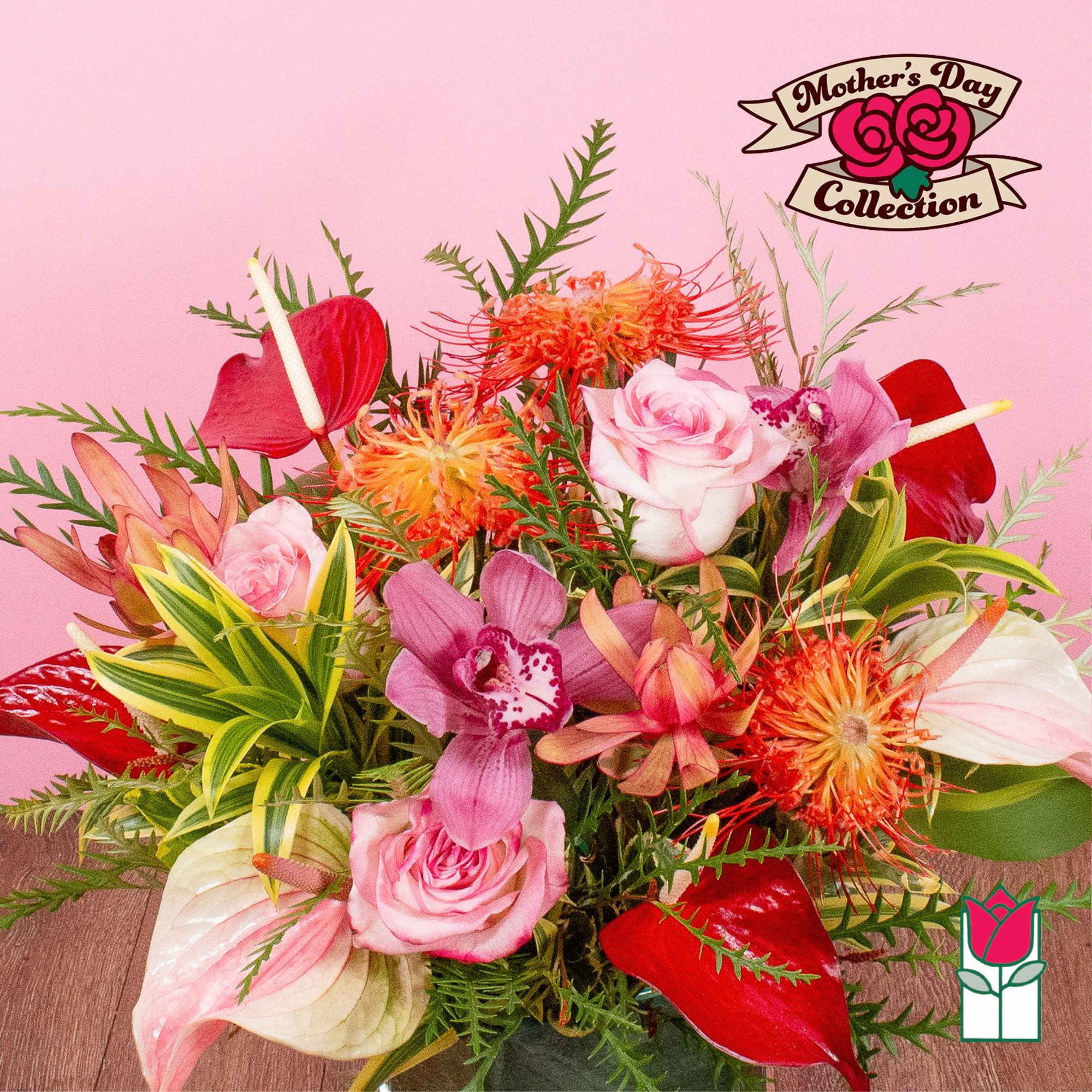 Vibrant arrangement of pink roses, orchids, anthuriums, and orange protea in a glass vase.