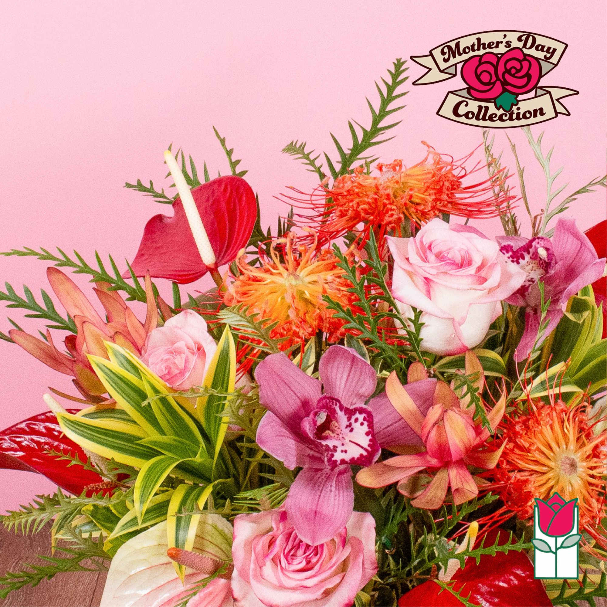Bright bouquet with pink roses, purple orchids, red anthuriums, and orange blooms with variegated green foliage.
