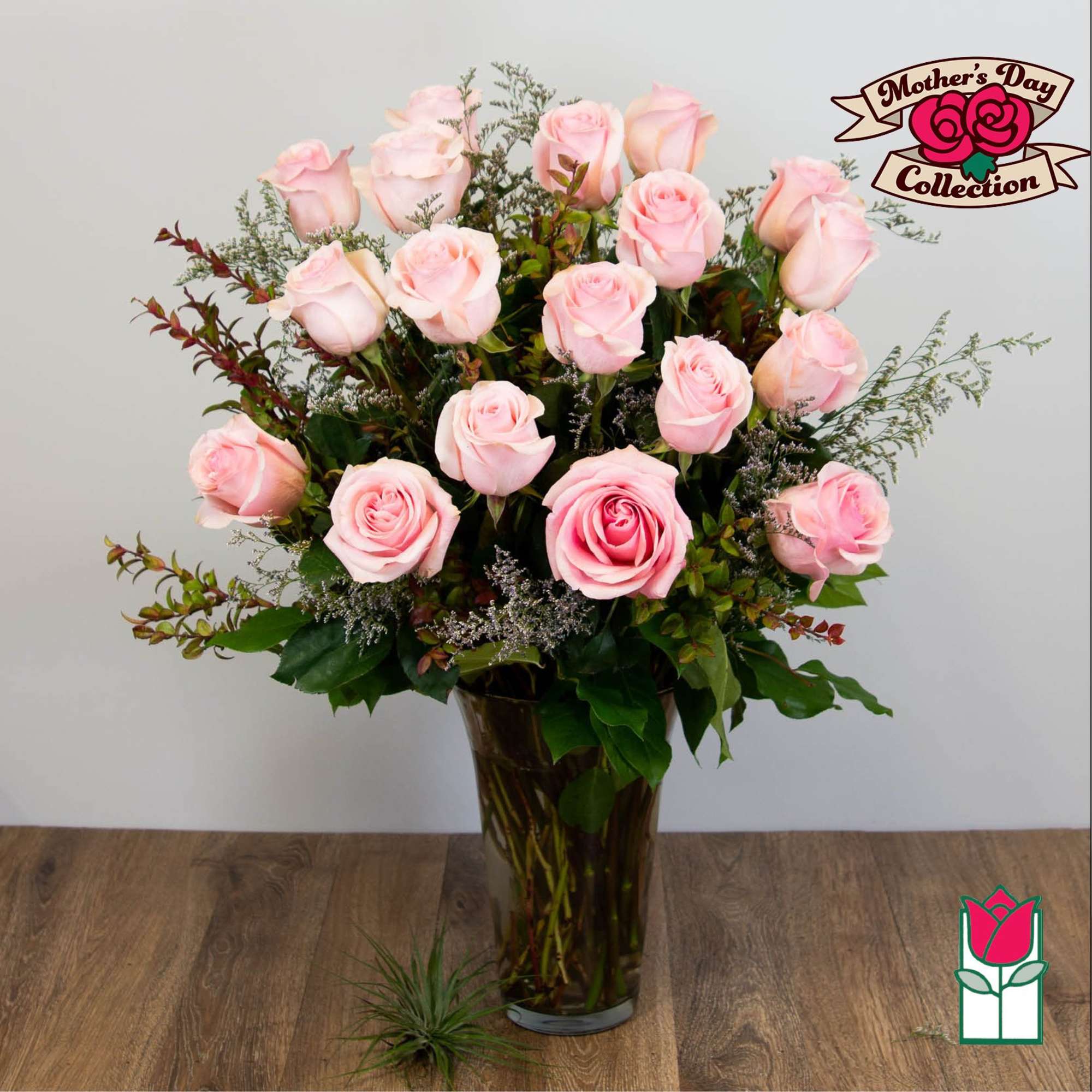 Pink roses arranged in a tall glass vase, photo 5 of 5
