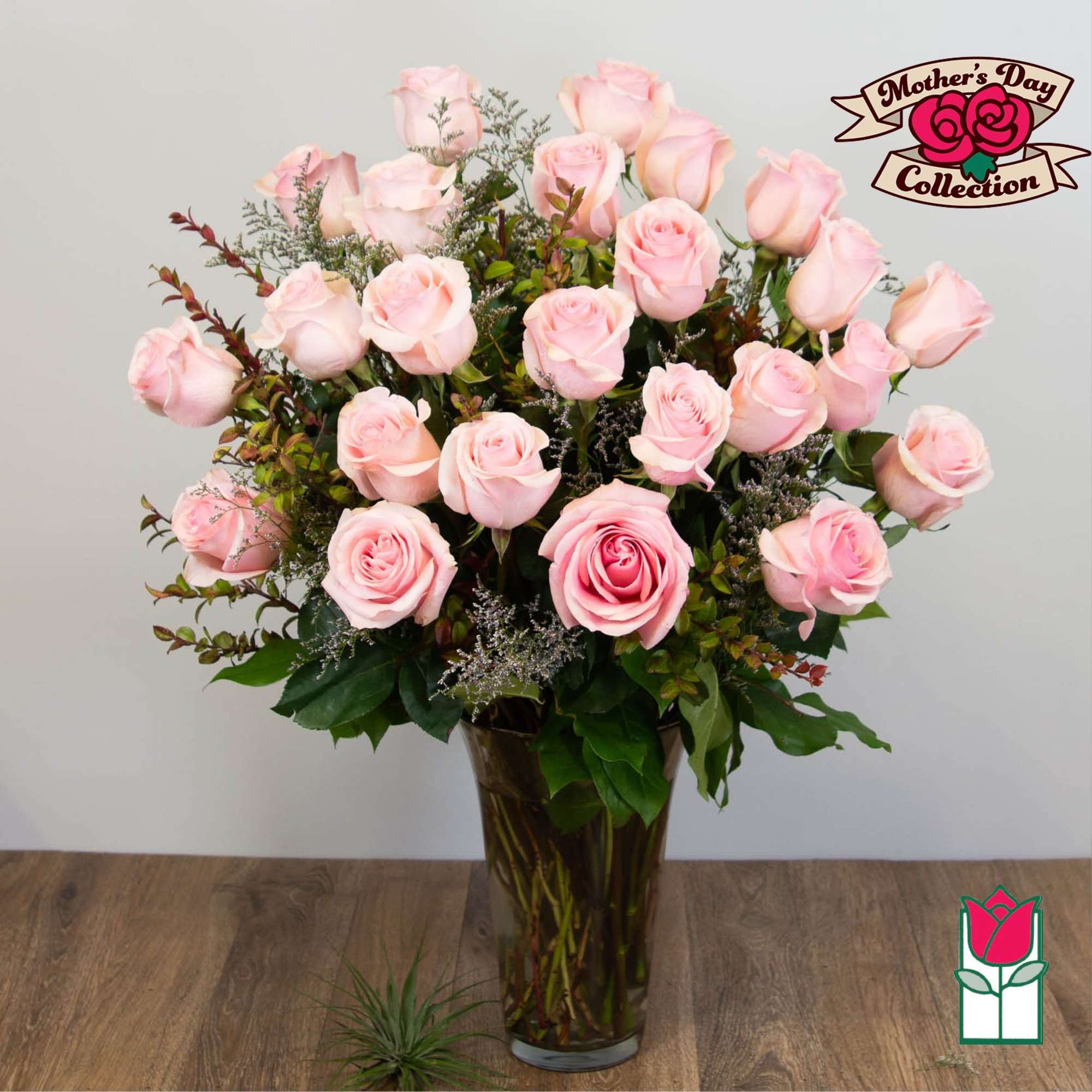 Pink roses arranged in a tall glass vase, photo 5 of 5
