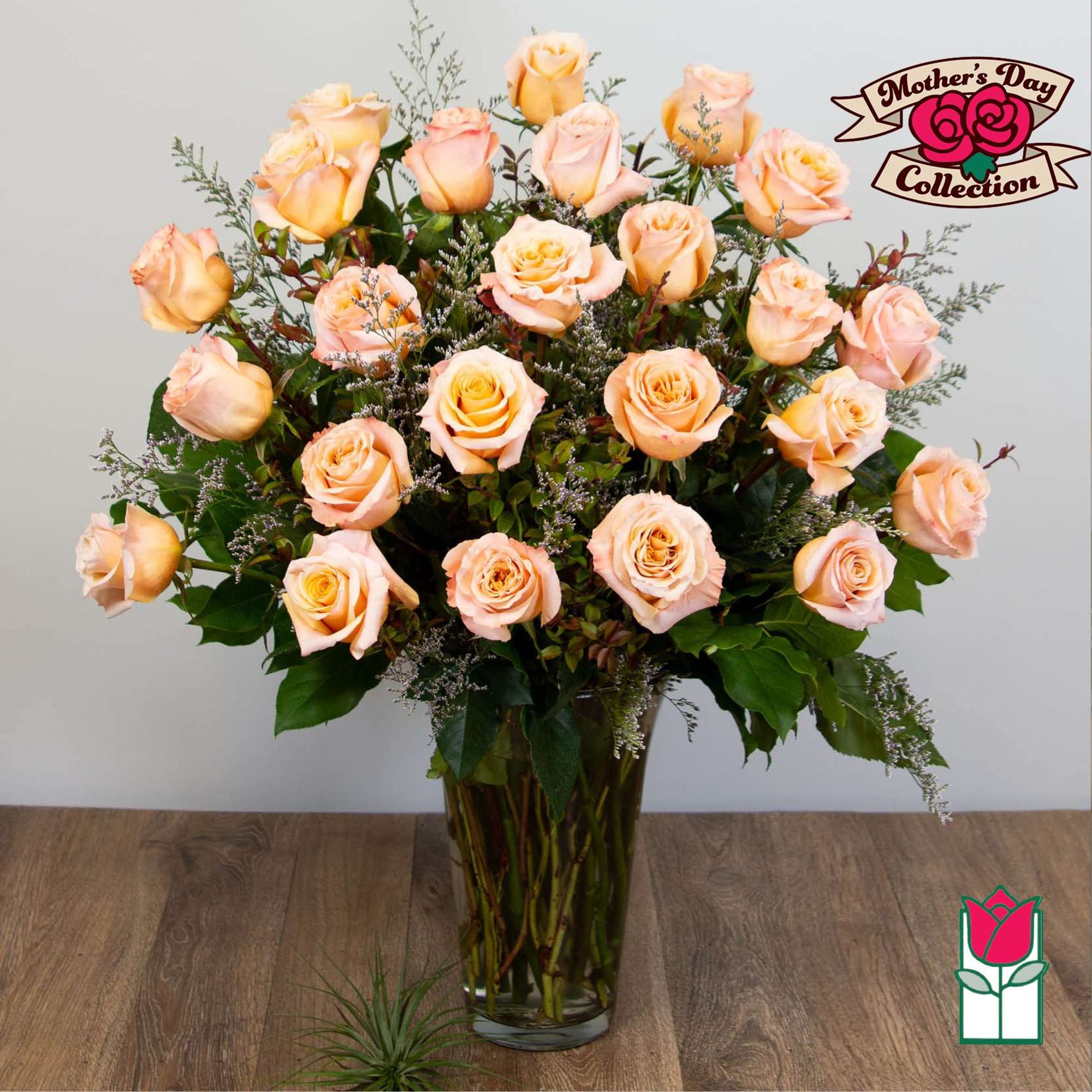 Peach roses arranged in a clear glass vase, photo 5 of 5