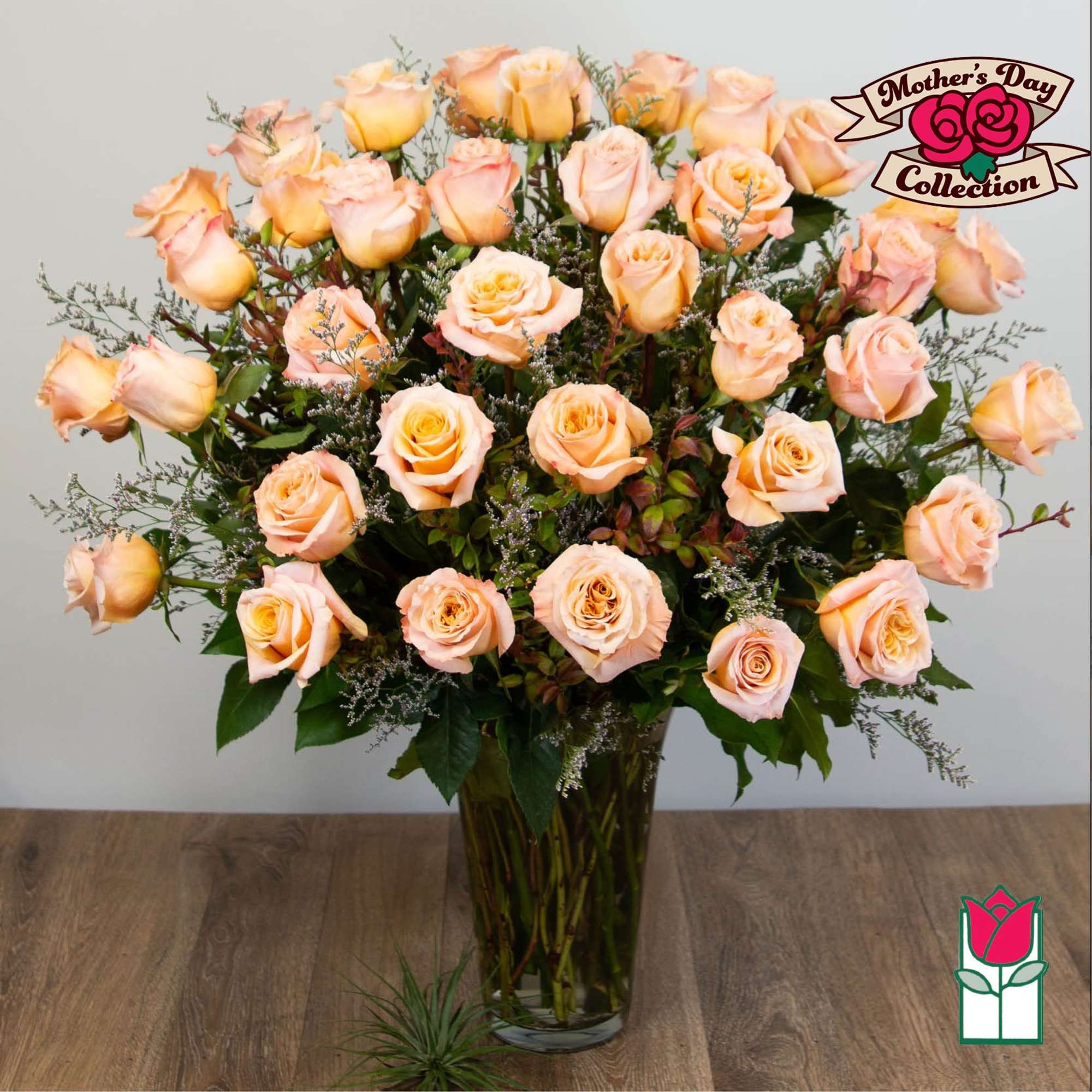 Peach roses arranged in a clear glass vase, photo 5 of 5