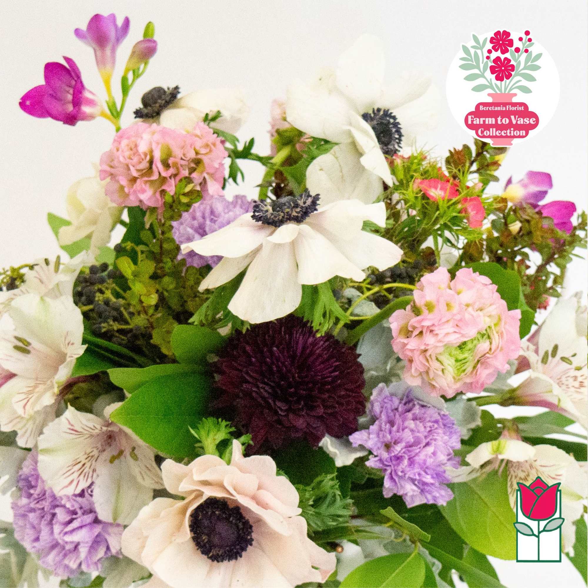 Mixed bouquet with white and pink flowers and purple accents