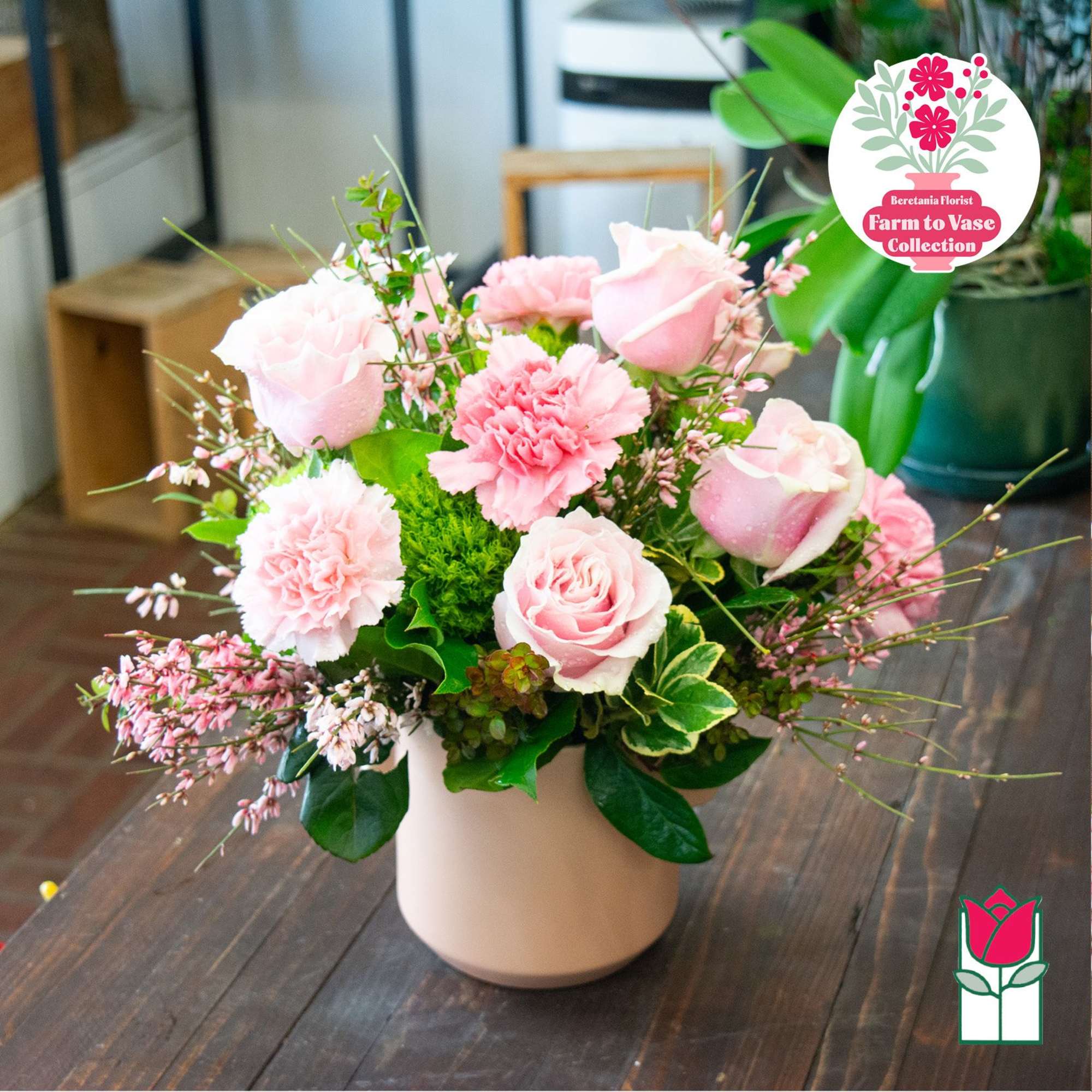 Pink roses and carnations arranged in a pale vase, photo 5 of 7