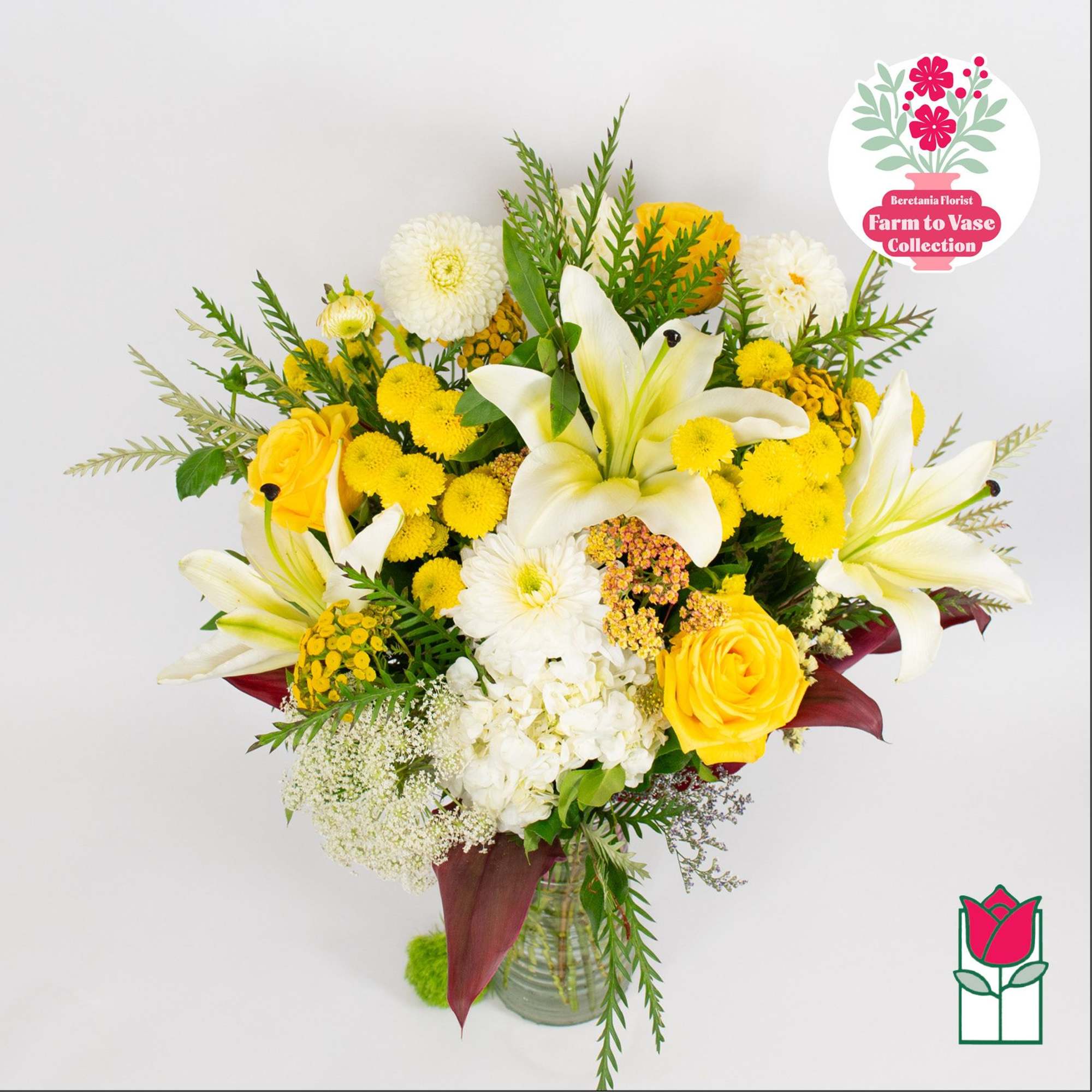 Yellow and white mixed bouquet in a glass vase