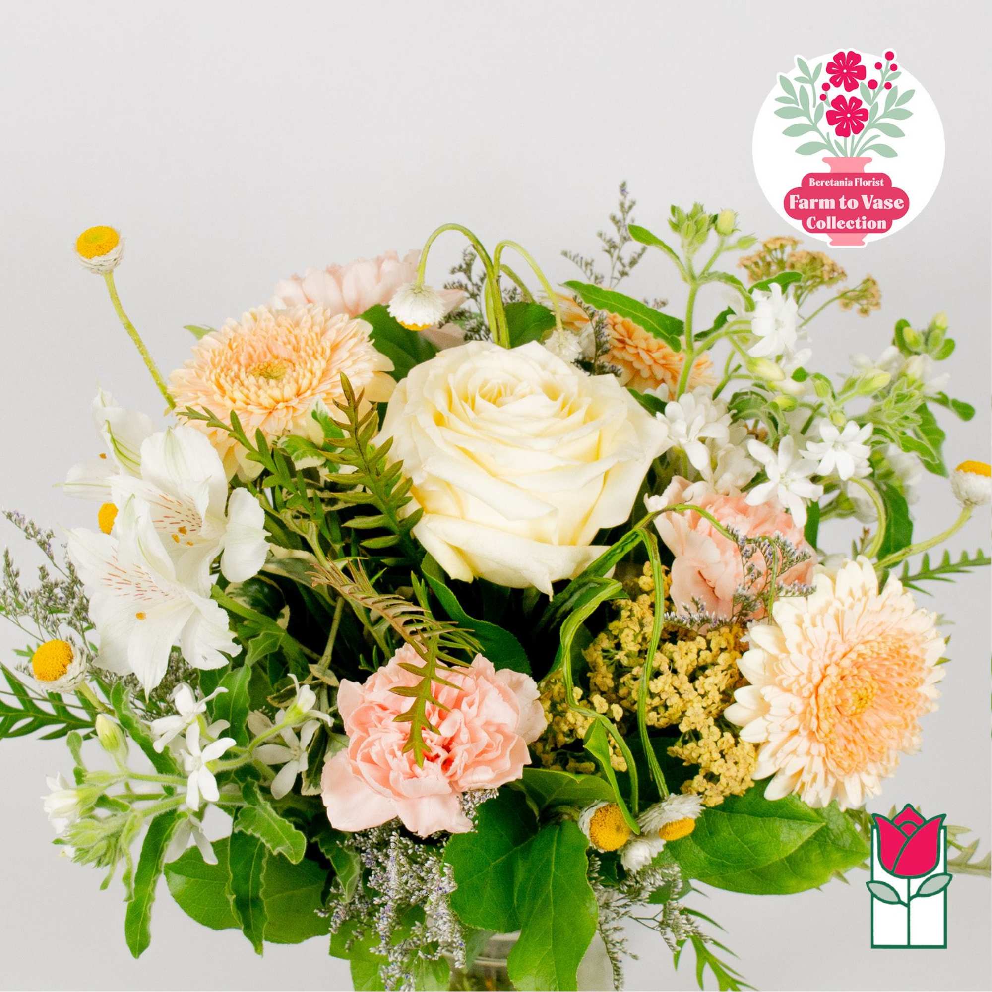 Mixed bouquet with white rose, peach blooms, and white alstroemeria