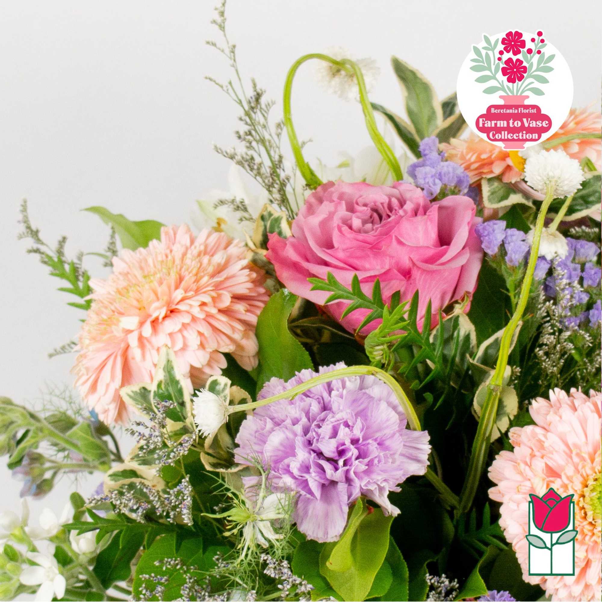 Mixed bouquet with pink, peach, and lavender flowers