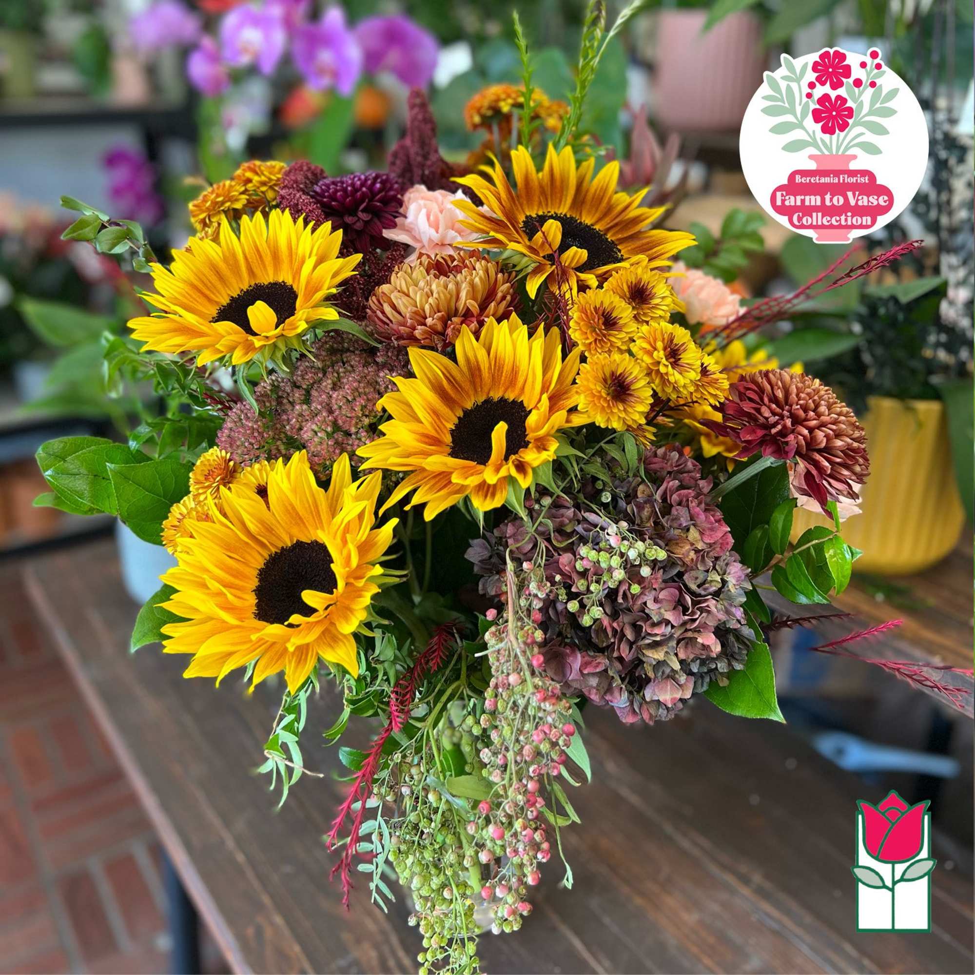Bouquet of sunflowers and mixed autumn flowers in a vase