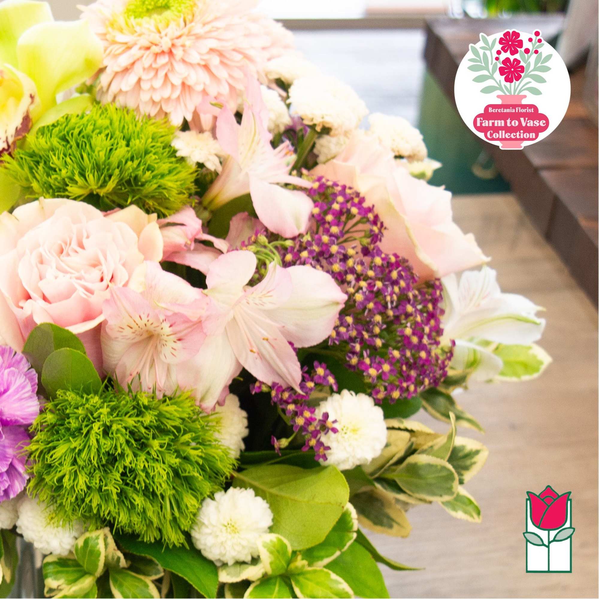 Bouquet of pale pink and white flowers with bright green blooms
