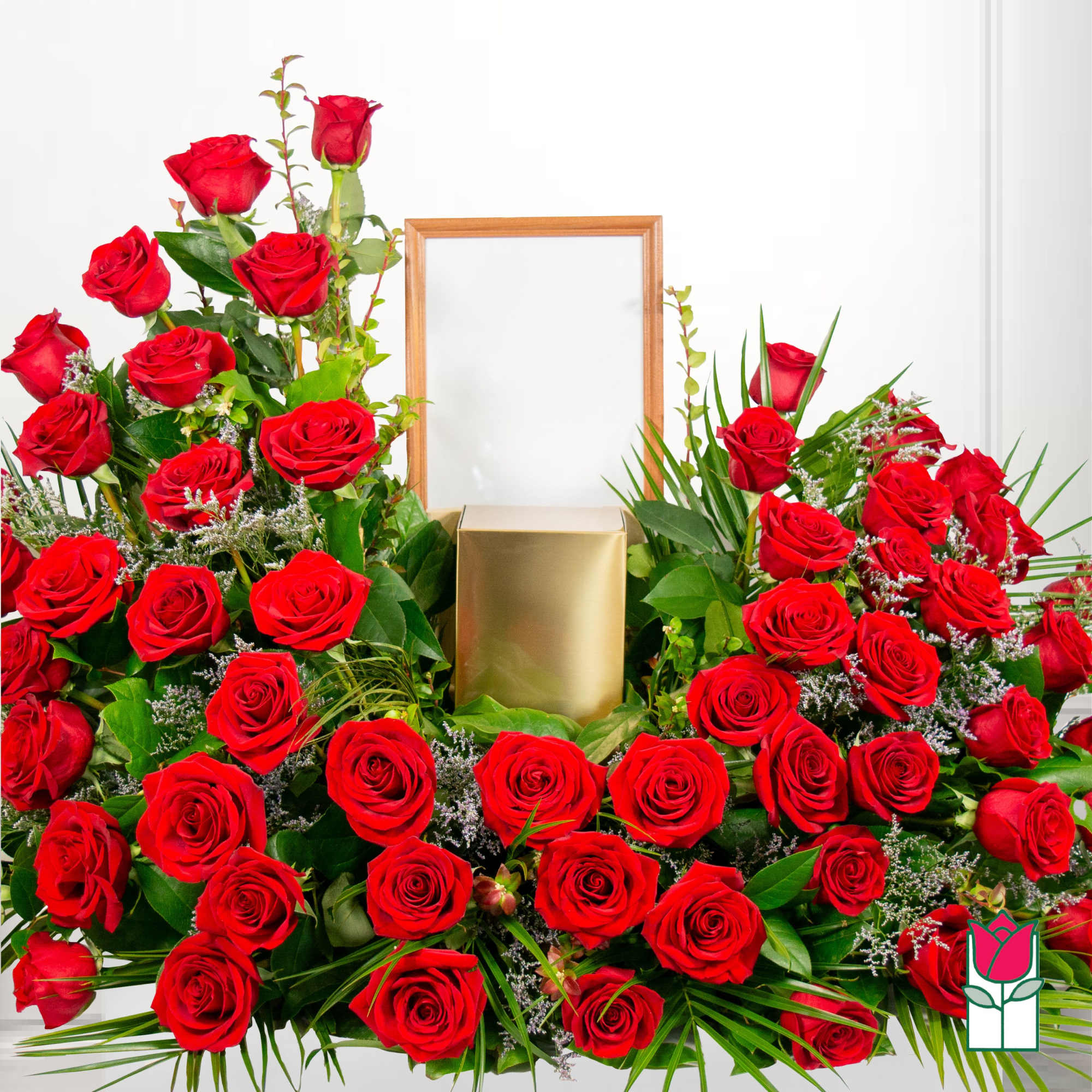 Large red rose arrangement with a gold urn and wooden frame