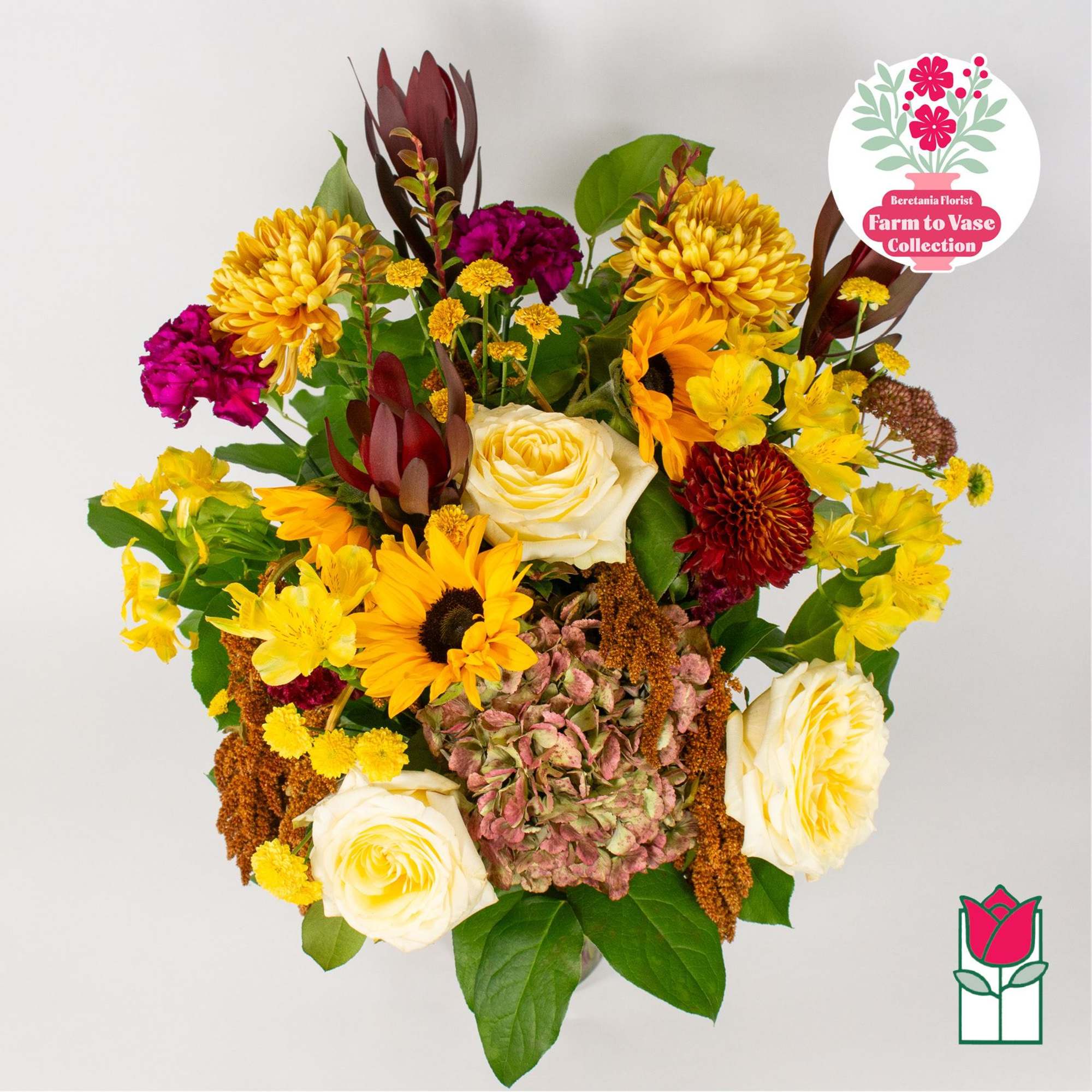 Mixed bouquet with yellow chrysanthemums, white roses, and sunflowers