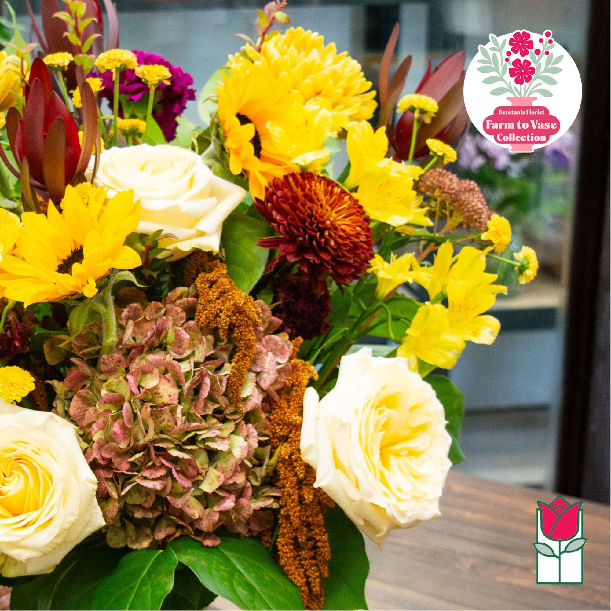 Bouquet of yellow and white flowers with burgundy accents