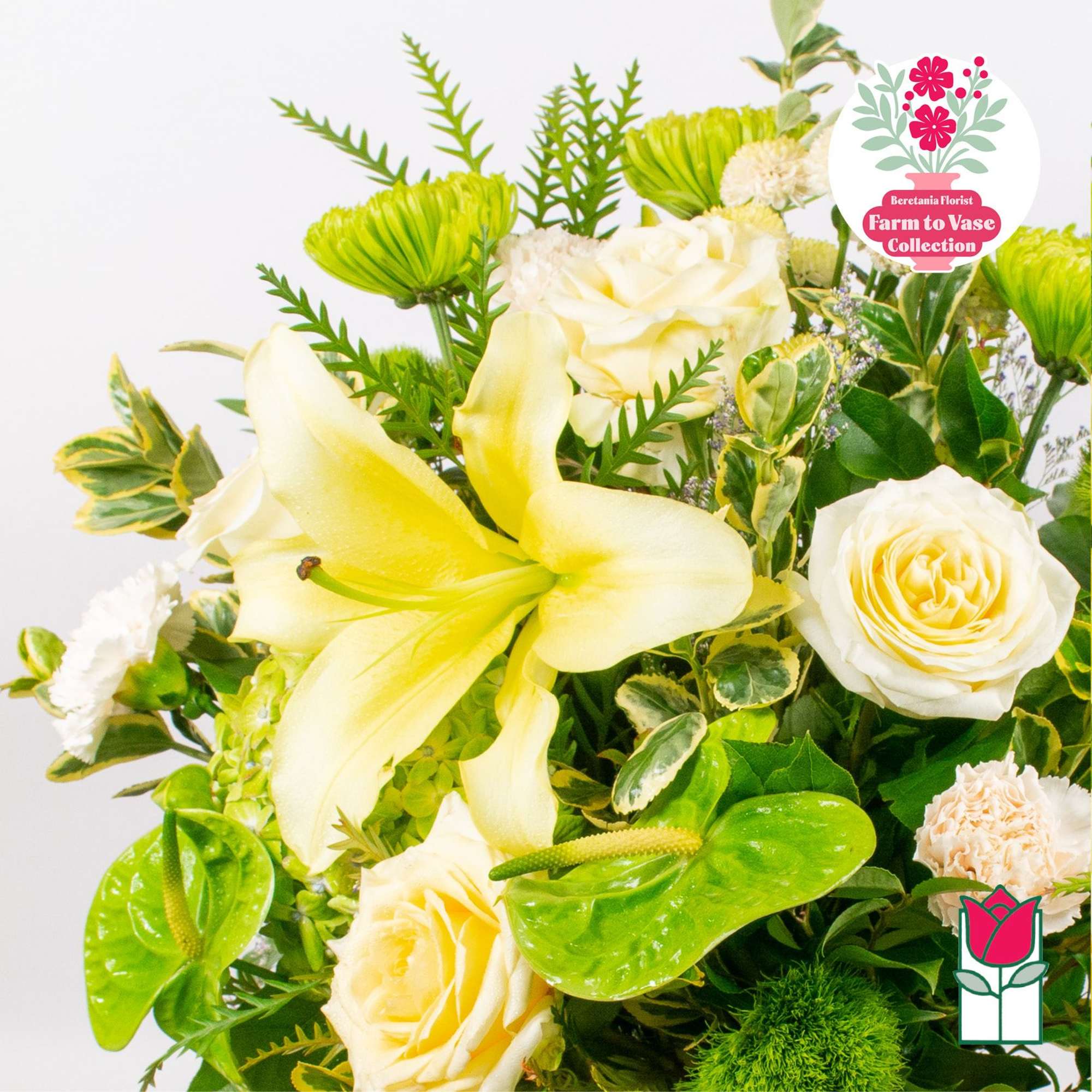 Bouquet of cream roses and yellow lilies with green accents