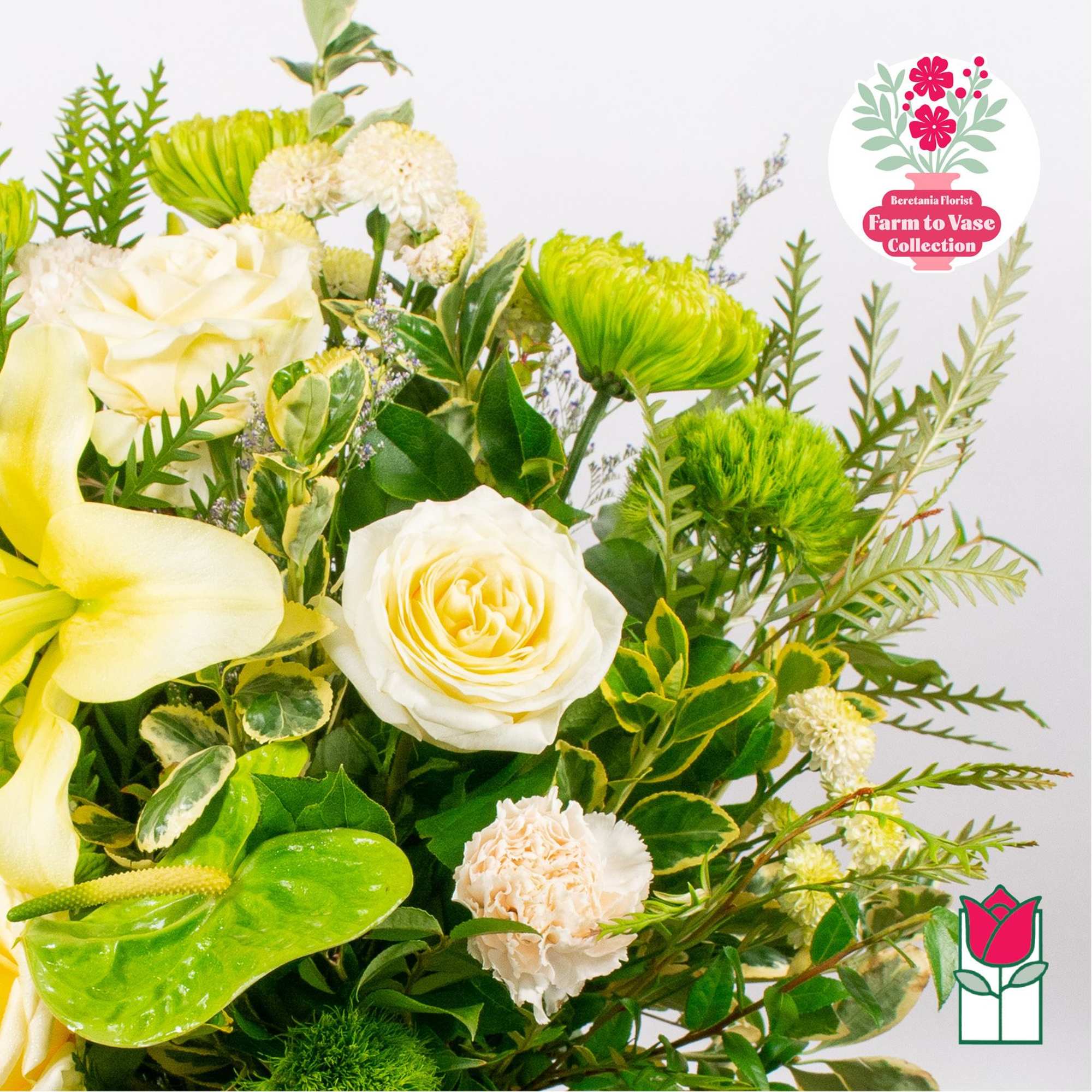 Yellow and white bouquet with roses, calla lilies, and green chrysanthemums