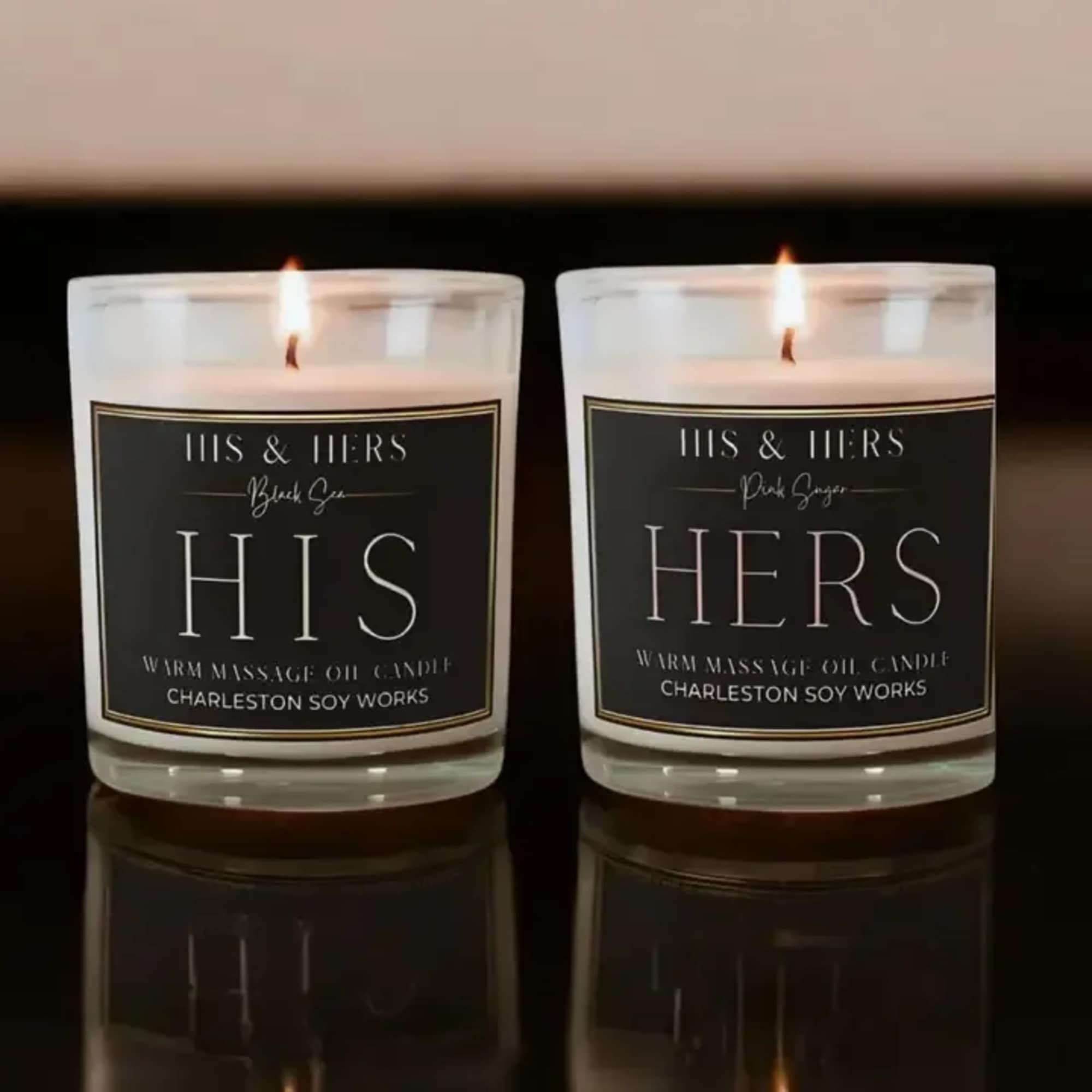Two lit glass candles labeled His and Hers