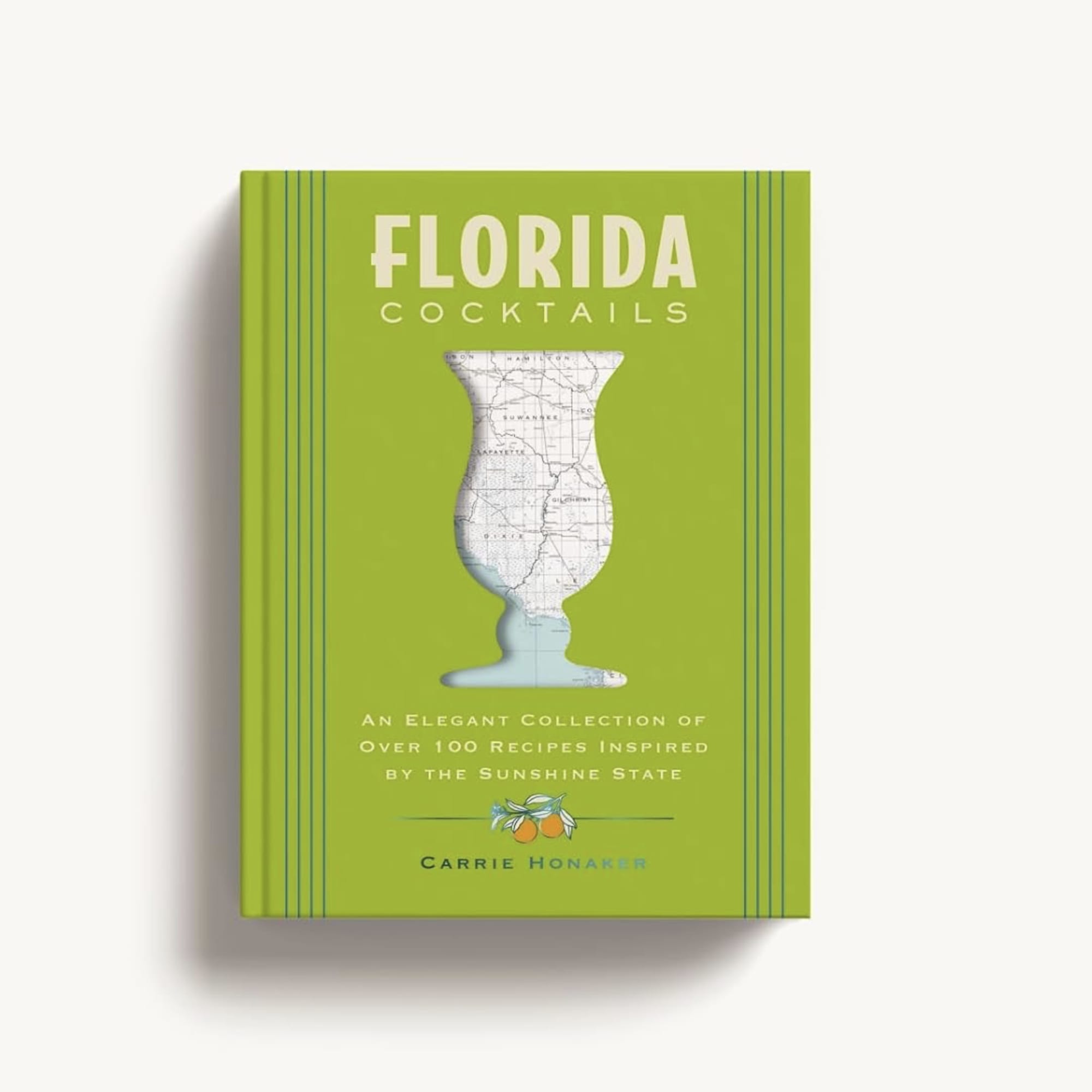 Green cookbook titled Florida Cocktails with a map-shaped glass illustration