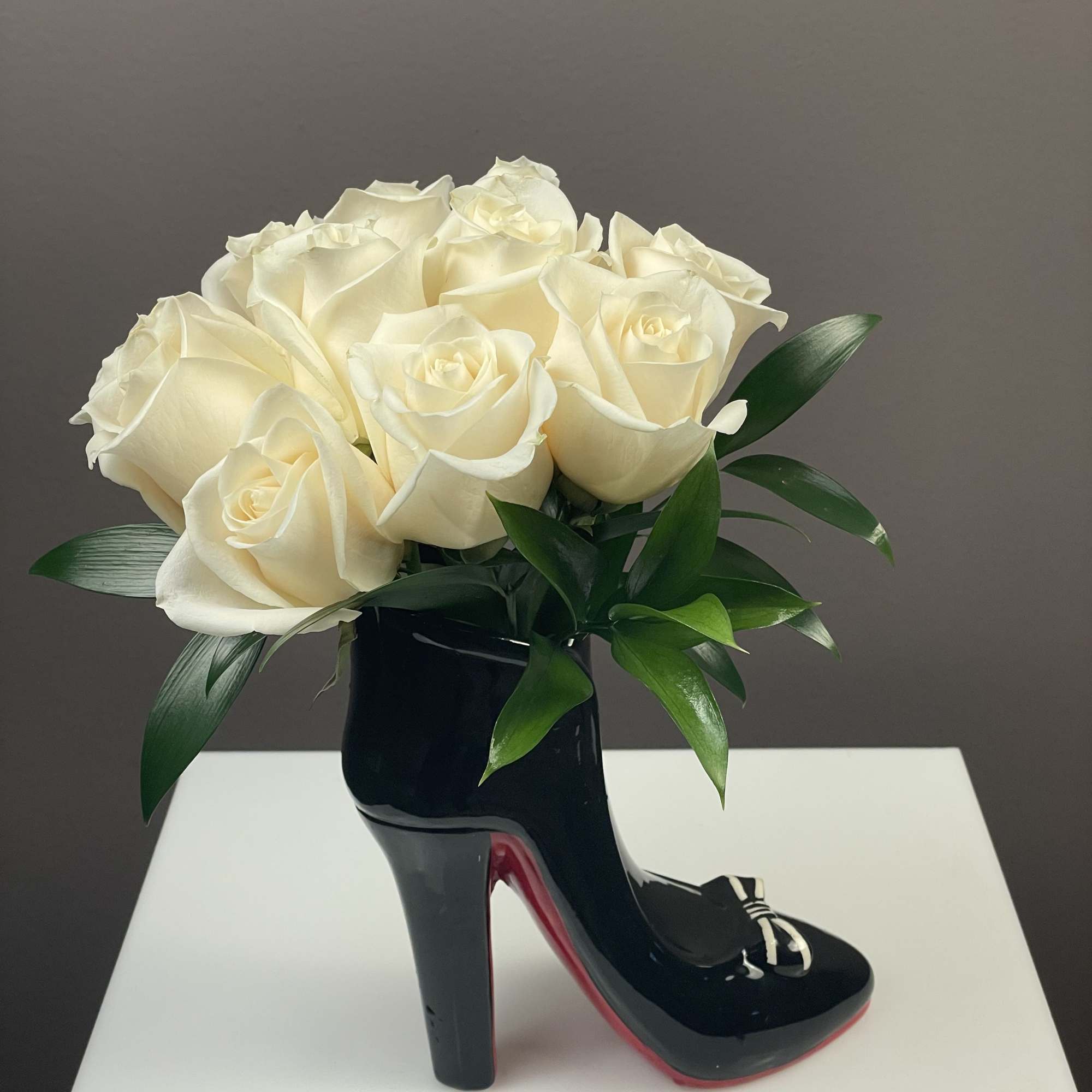 Step into style with our most requested floral arrangement! This chic, high-fashion