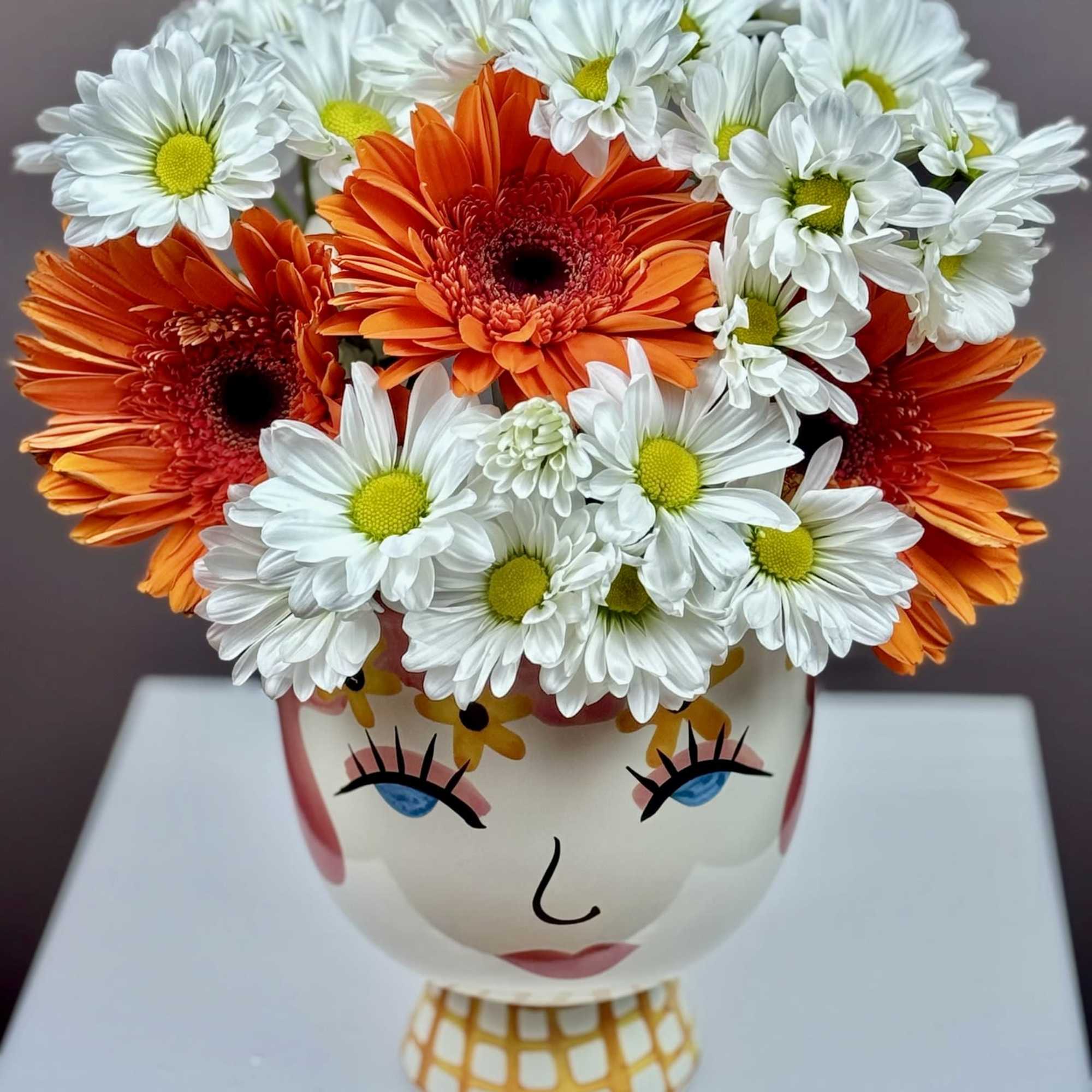 This cheerful arrangement is designed to bring a playful burst of personality