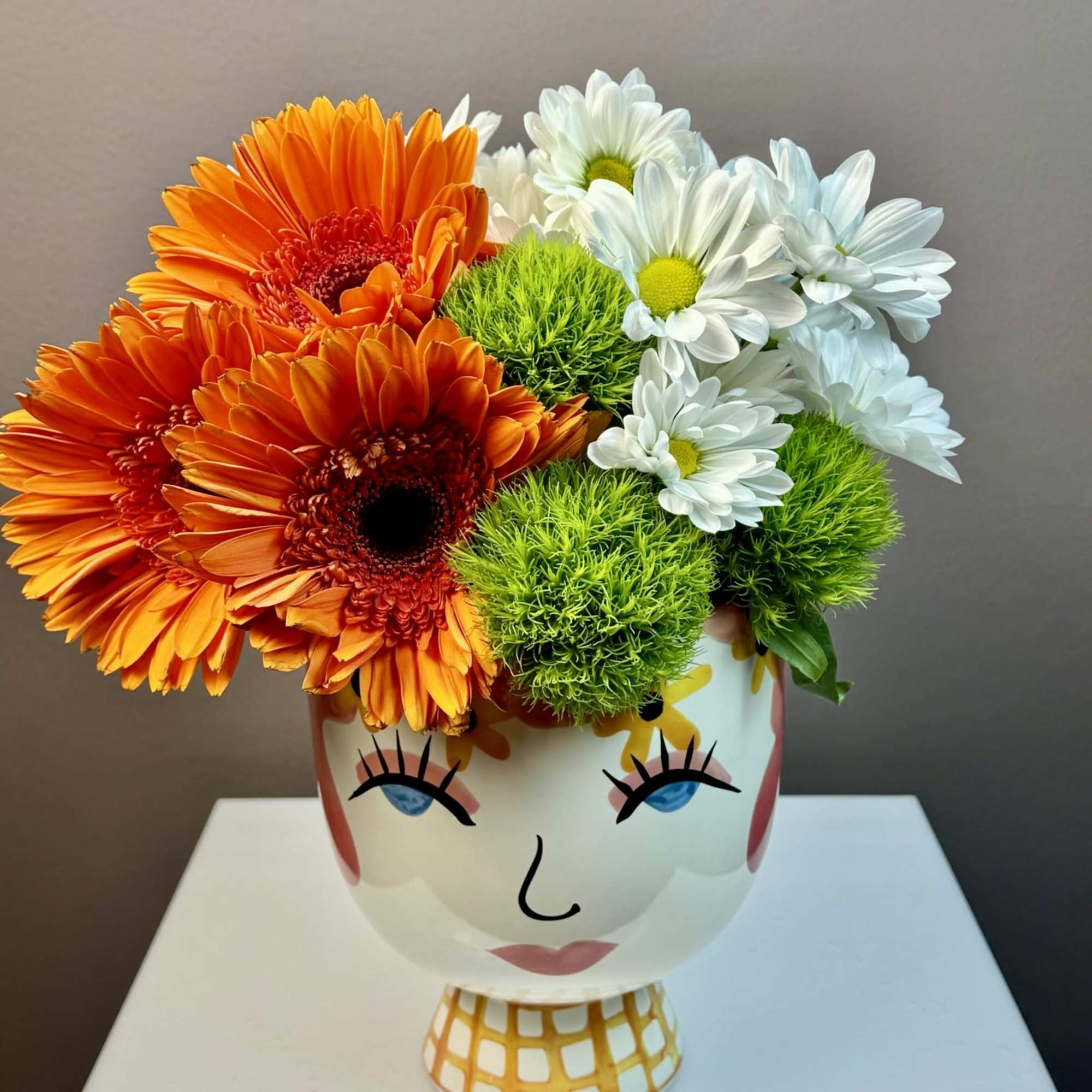 This cheerful arrangement is designed to bring a playful burst of personality