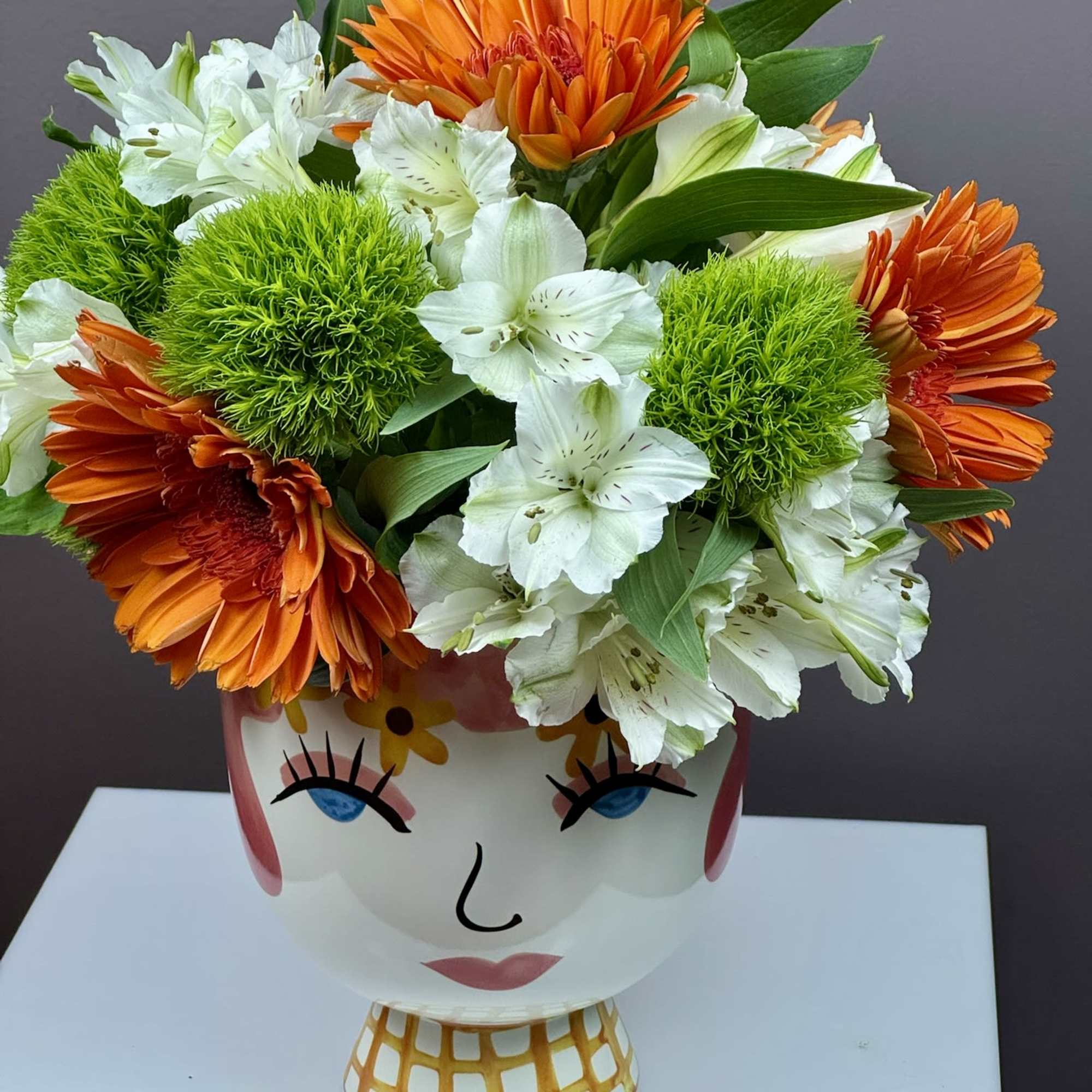 This cheerful arrangement is designed to bring a playful burst of personality, photo 2 of 2