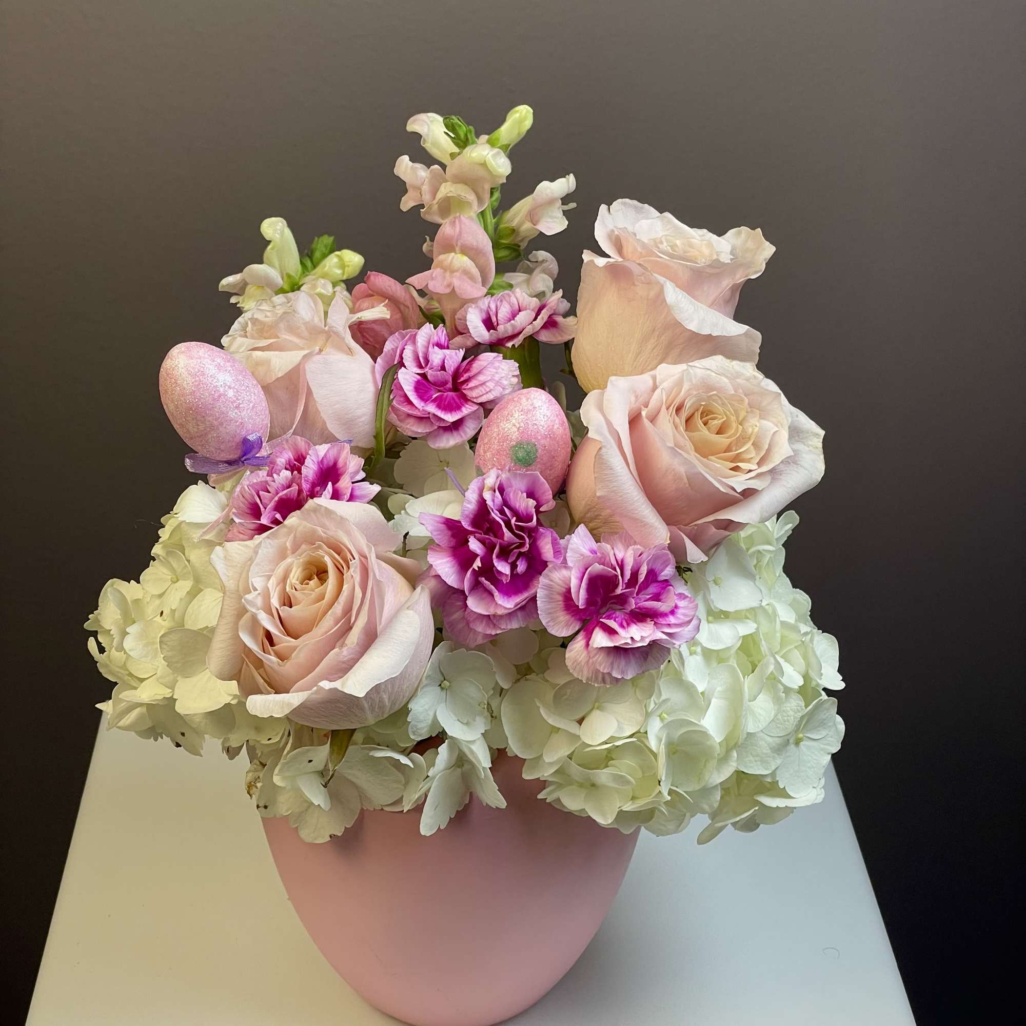 Hop into spring with our Some-Bunny Special arrangement! This playful Easter design