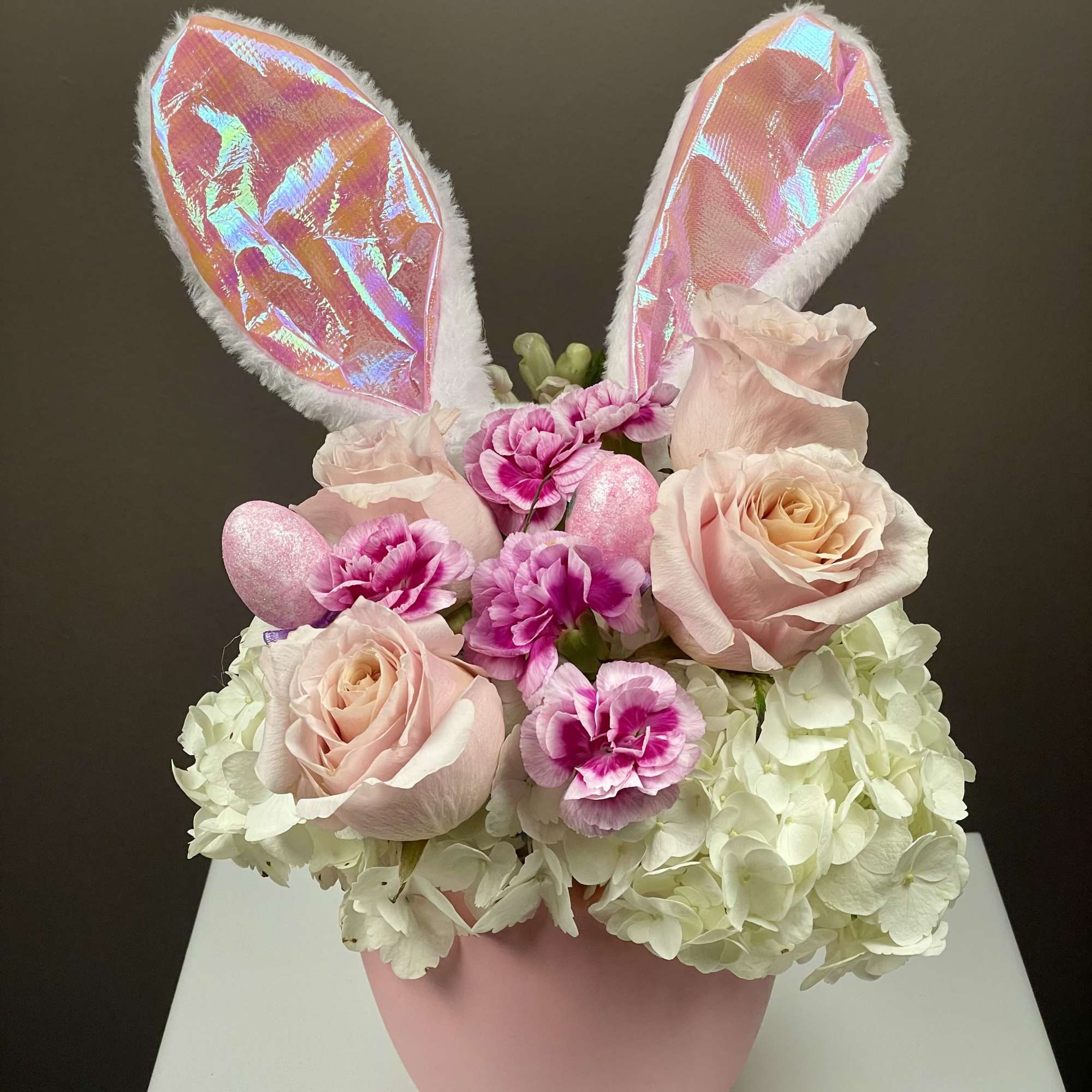 Hop into spring with our Some-Bunny Special arrangement! This playful Easter design