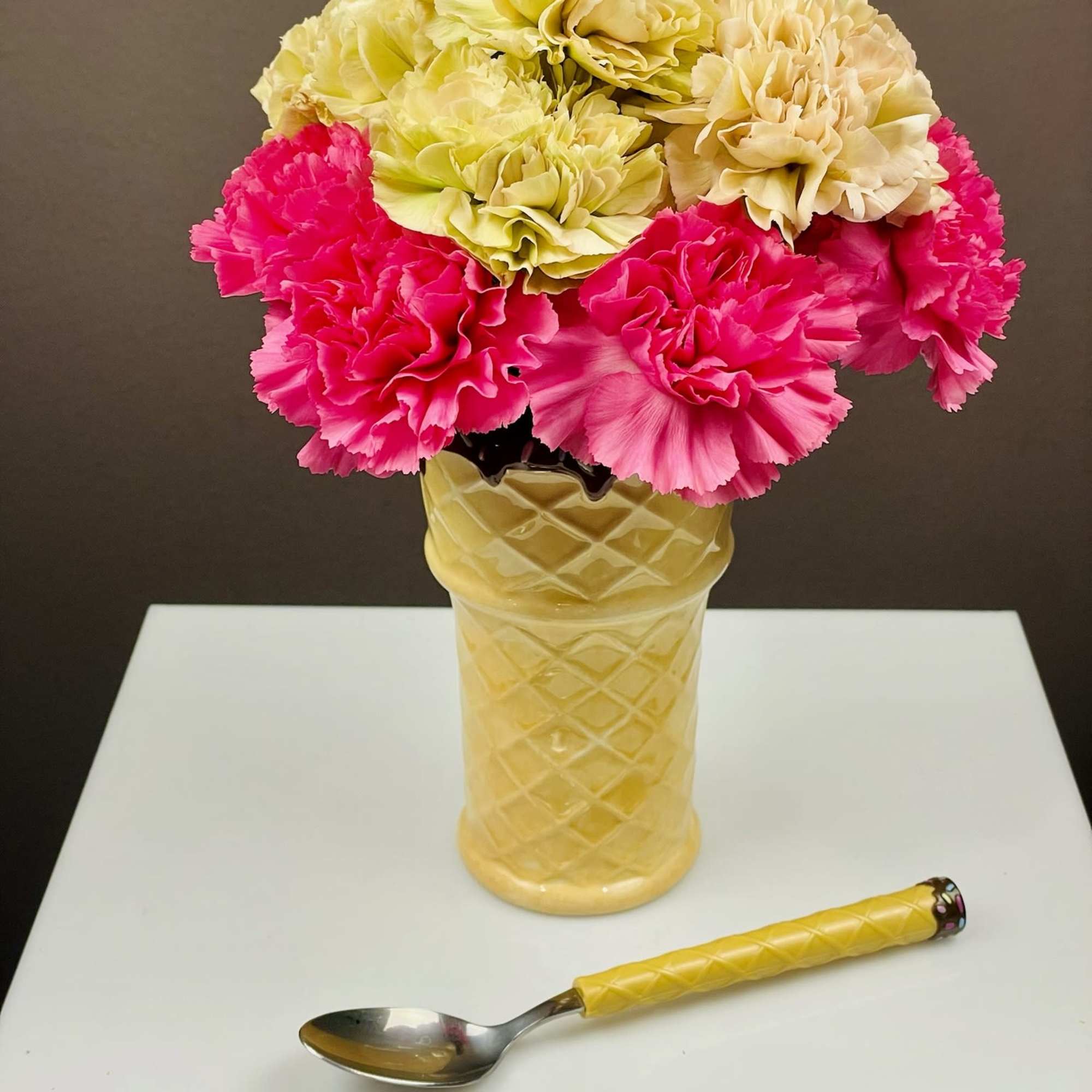 A charming, dessert‑inspired arrangement designed to look like a floral sundae. Carnations