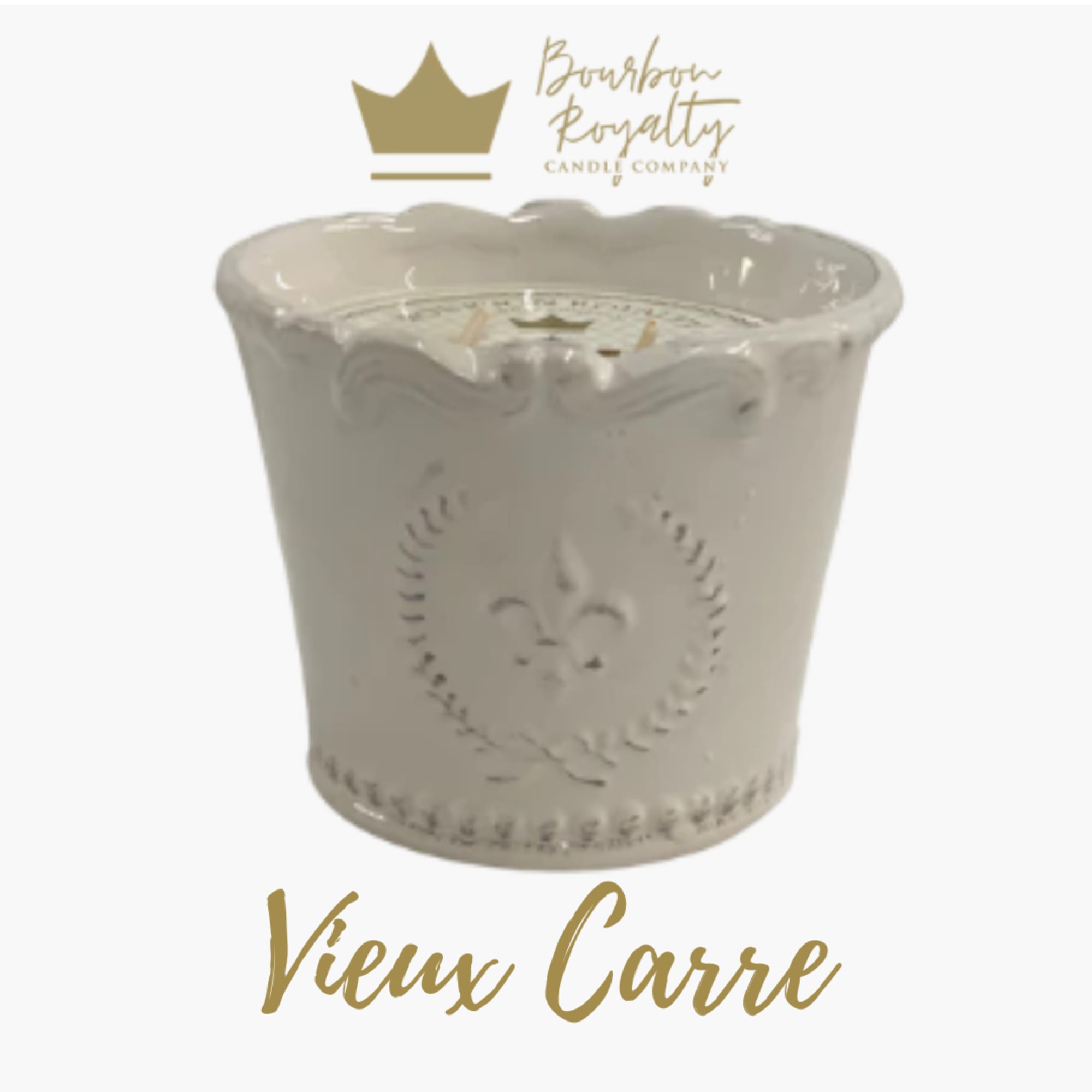 White decorative candle in a scalloped ceramic container