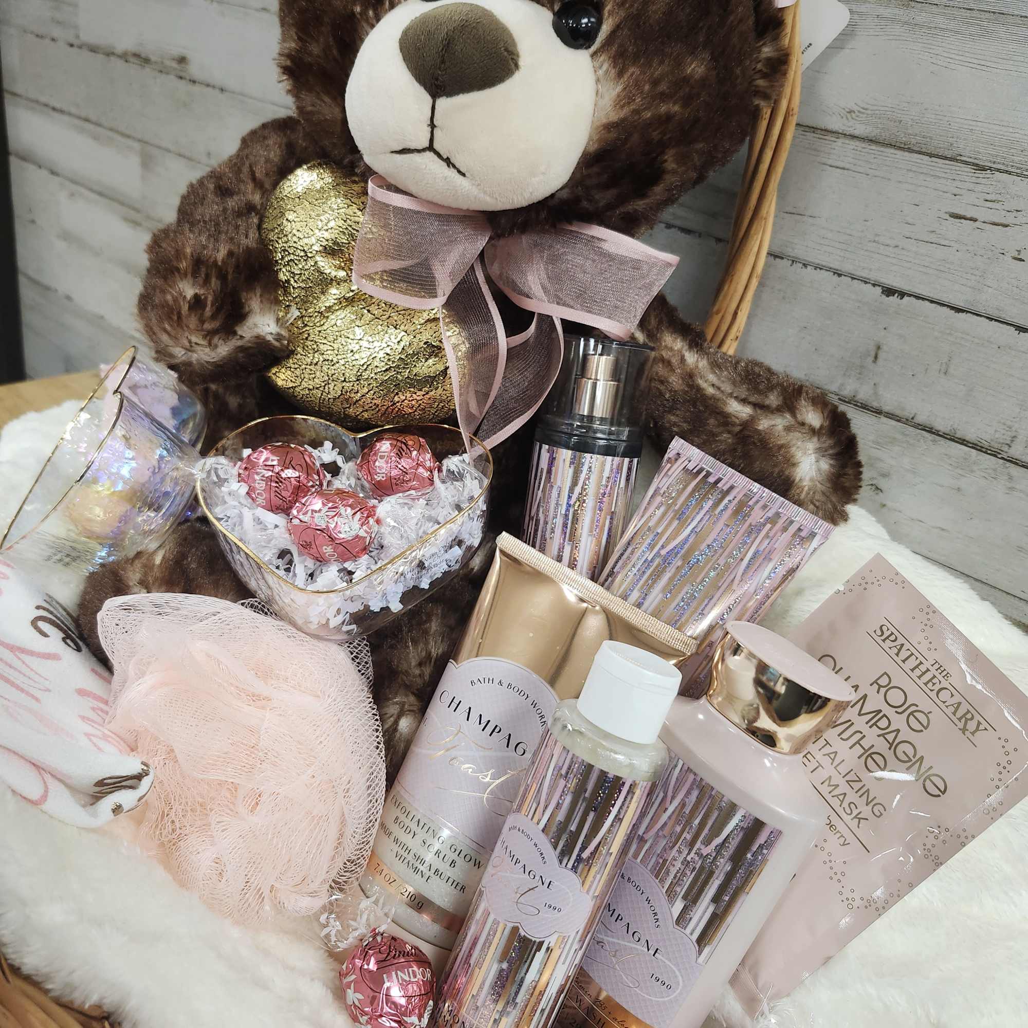 Teddy bear gift basket with chocolates and bath products