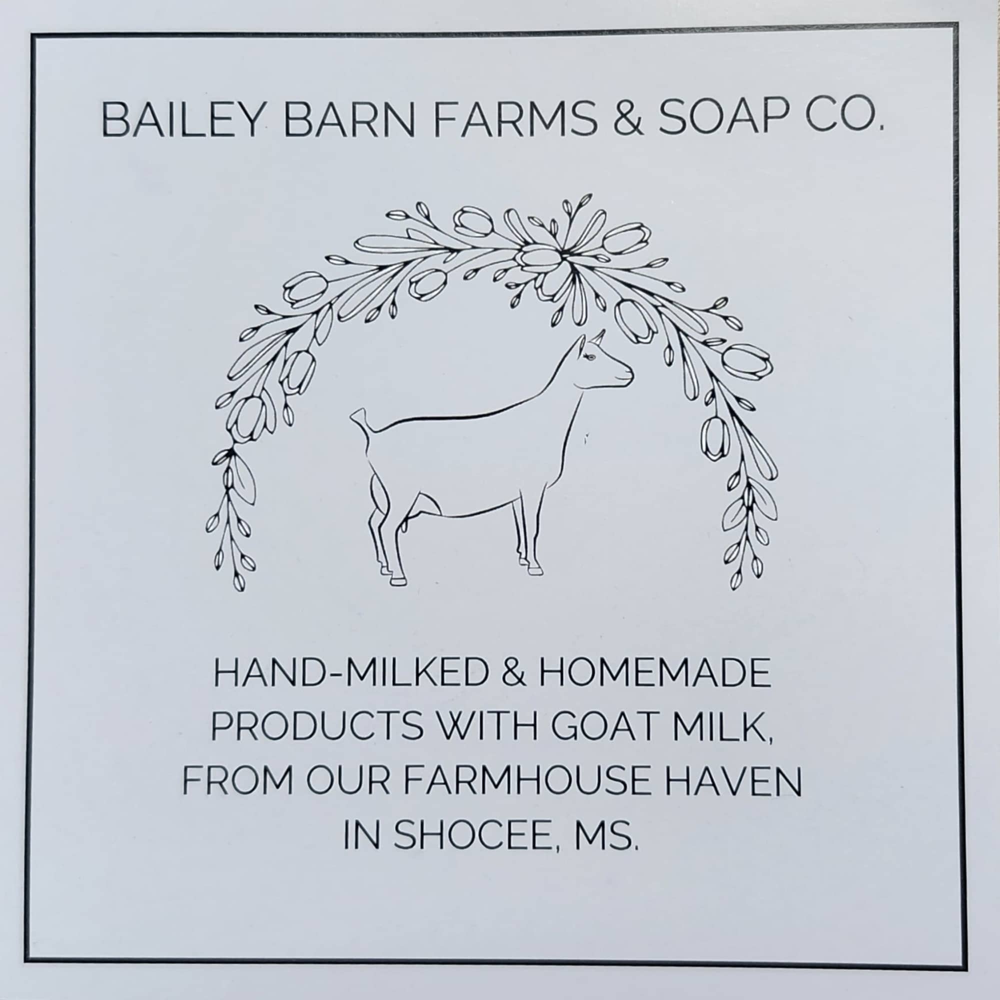 Printed sign with a goat logo and floral arch illustration