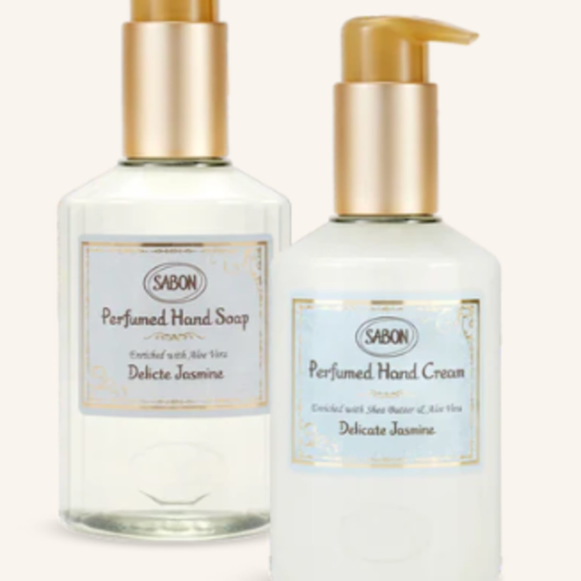Two pump bottles of scented hand soap and hand cream