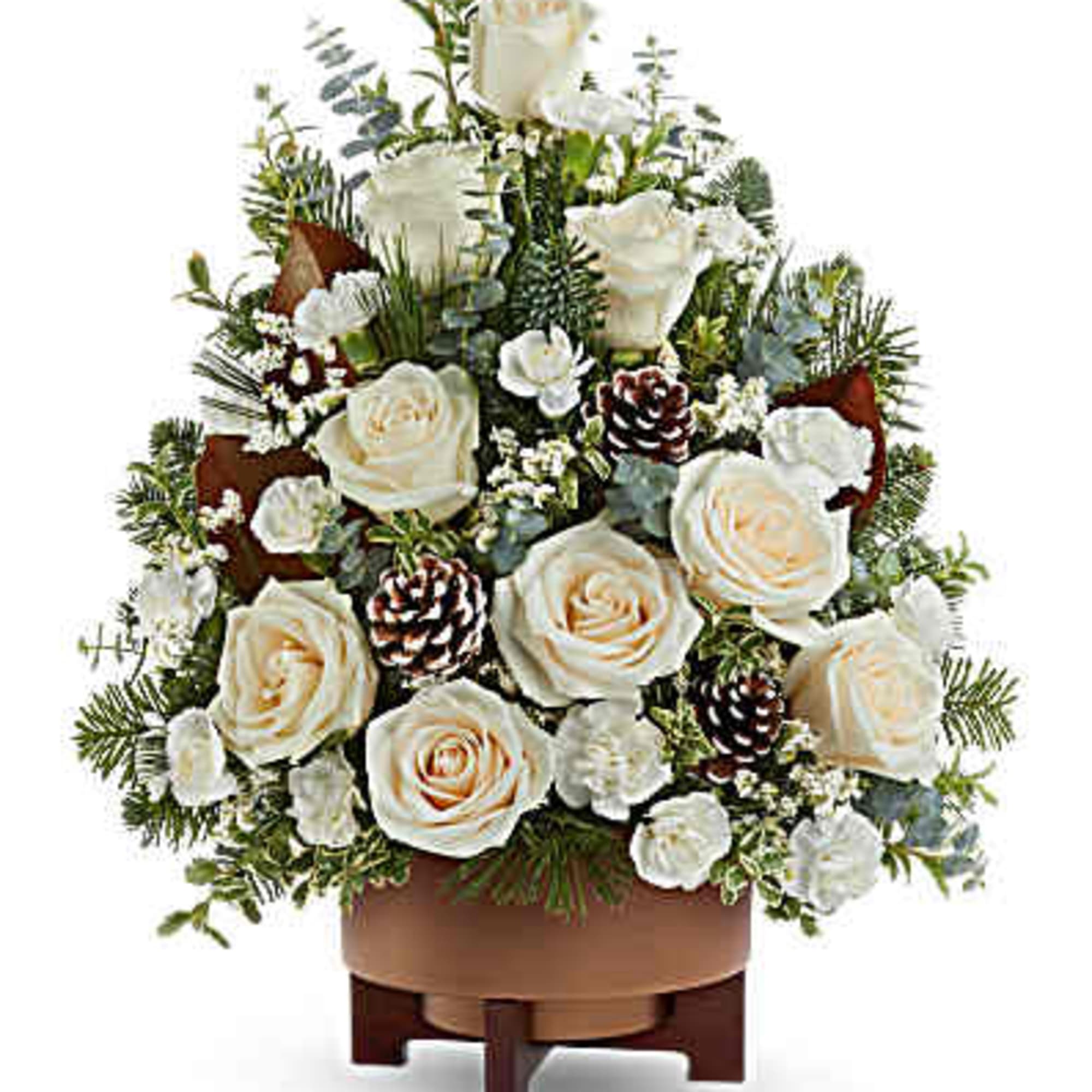 White rose arrangement with pinecones in a brown container